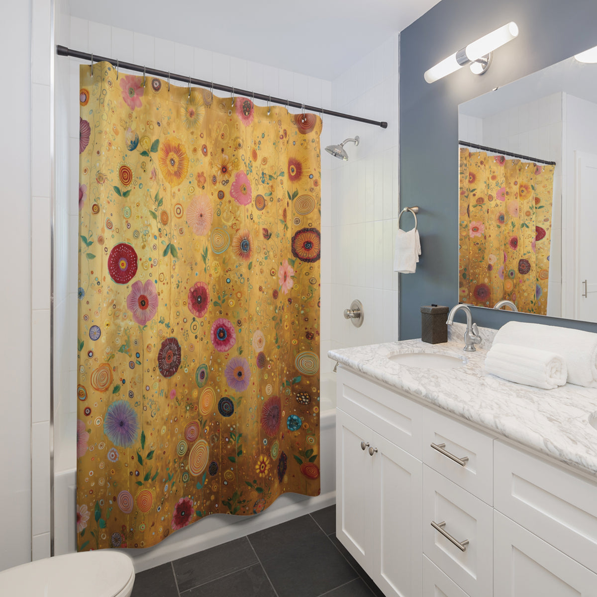 A shower curtain with a vintage floral art print in gold, pink, red, and green, hanging in a modern white and blue bathroom next to a marble vanity.