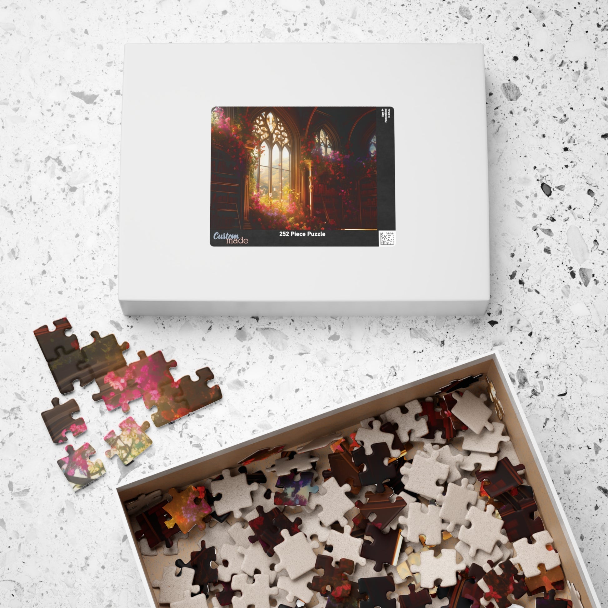Jigsaw puzzle set with pieces and packaging on a textured surface