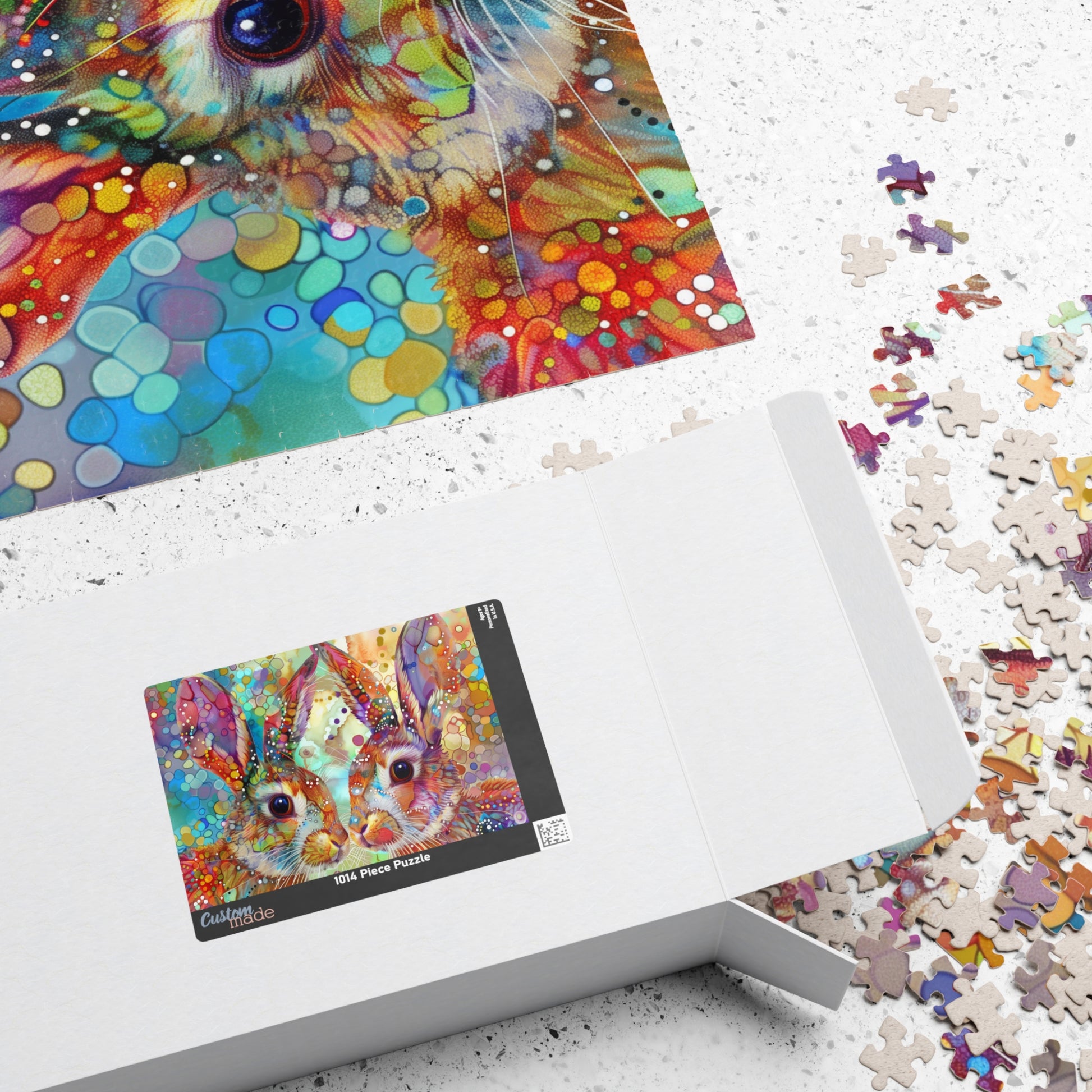 Colorful puzzle with a box and scattered pieces on a white surface