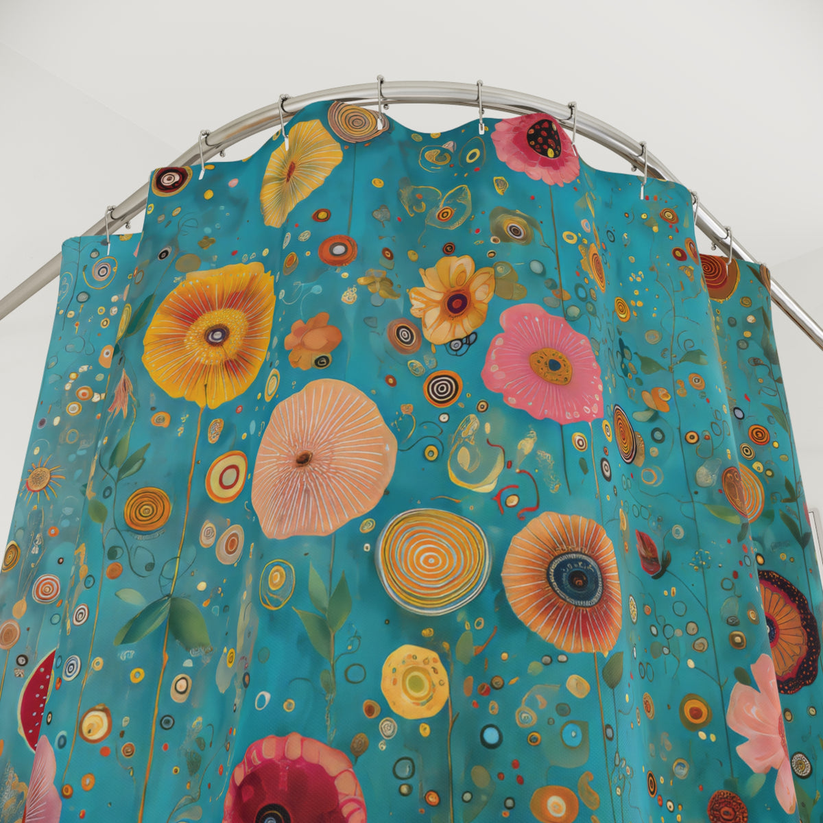 A teal shower curtain featuring a vibrant, retro-style floral pattern with large poppy-like flowers in yellow, pink, orange, and red, hanging from a curved metal rod against a plain white wall.