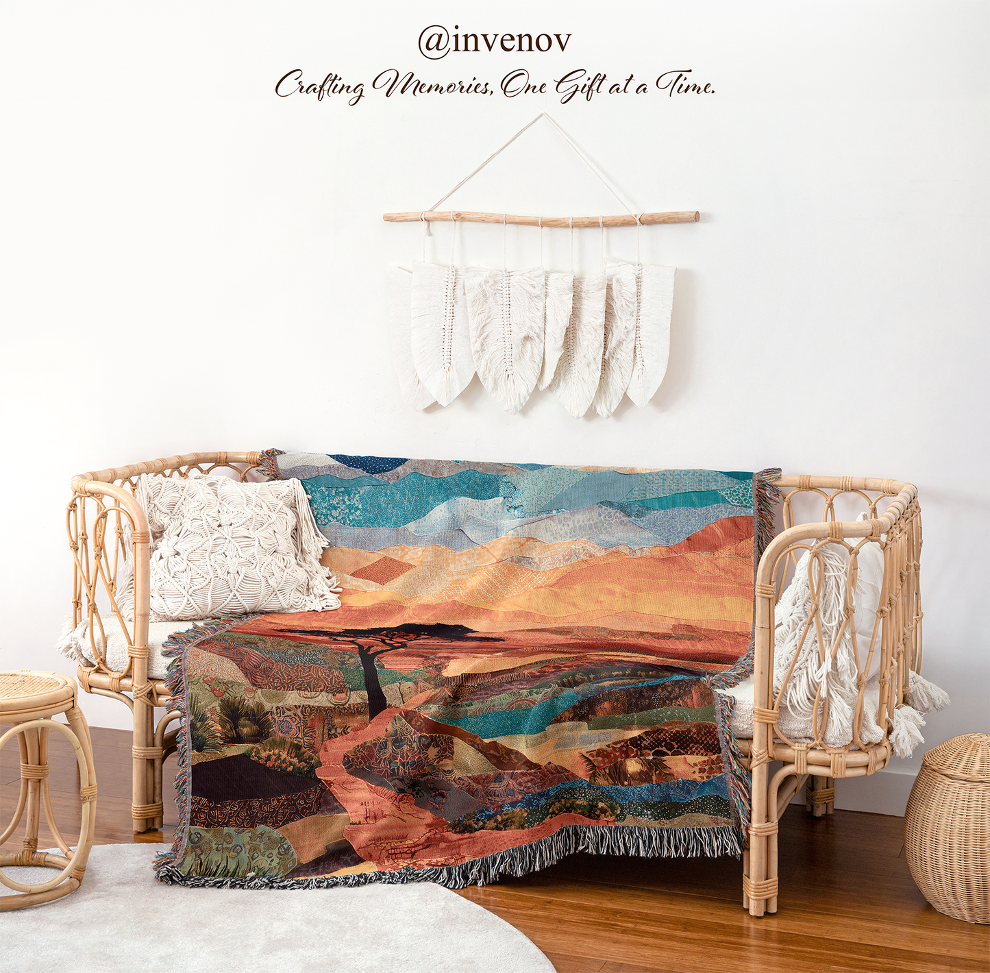 Woven blanket with landscape design draped over a wicker chair
