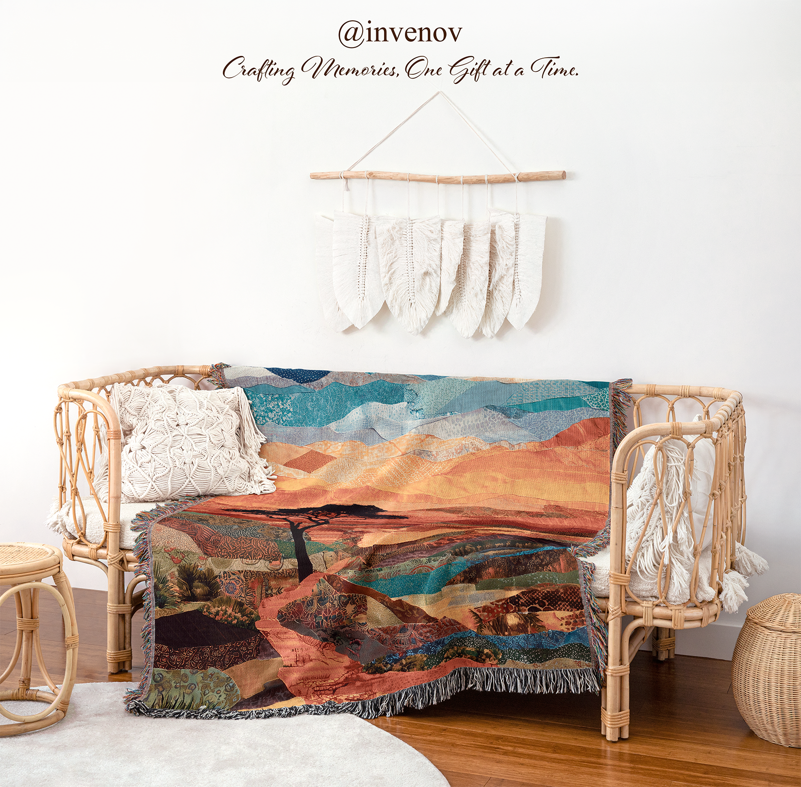 Woven blanket with landscape design draped over a wicker chair