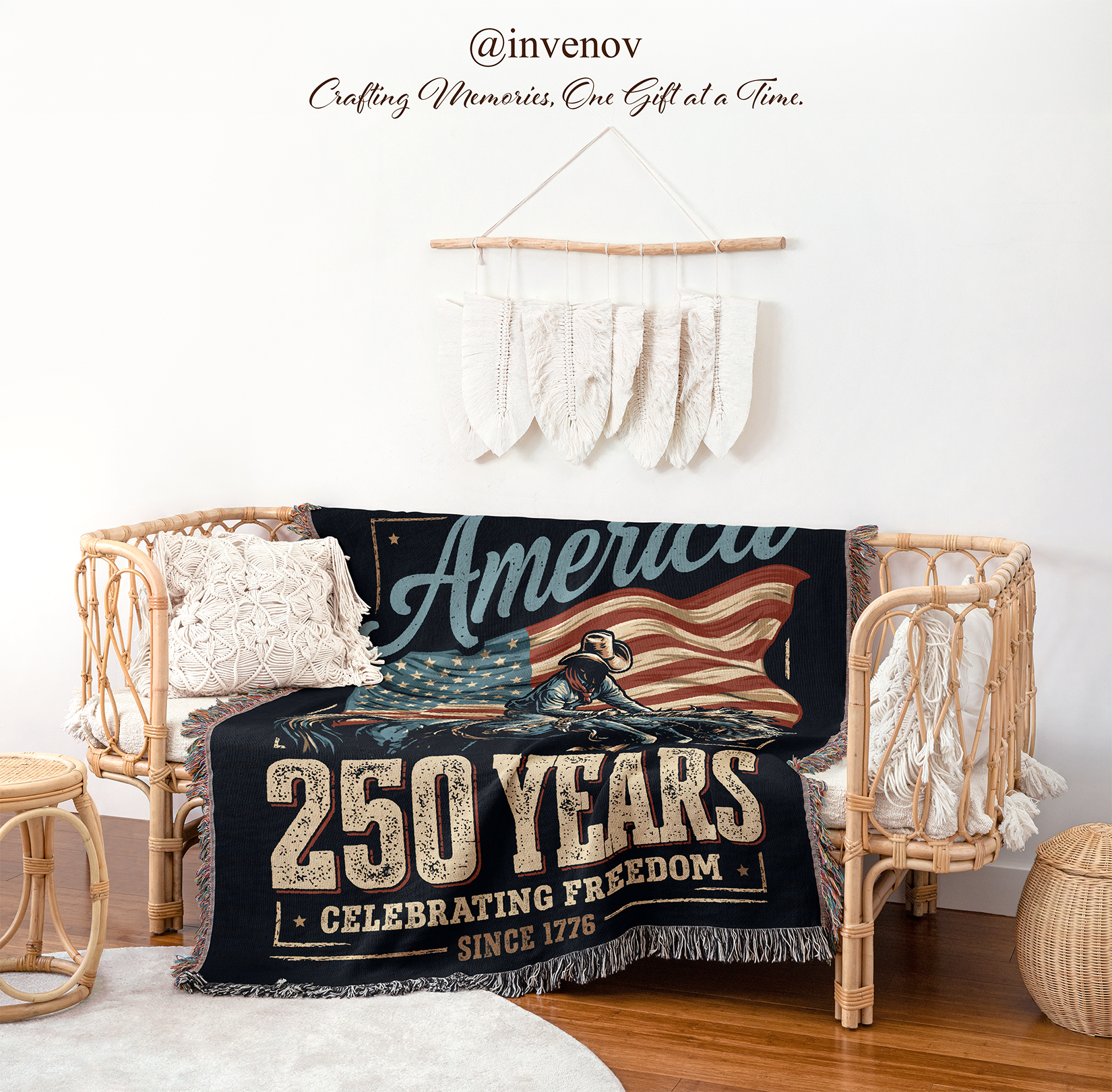 Decorative blanket with 'America 250 Years Celebrating Freedom Since 1776' design draped over a chair in a room.