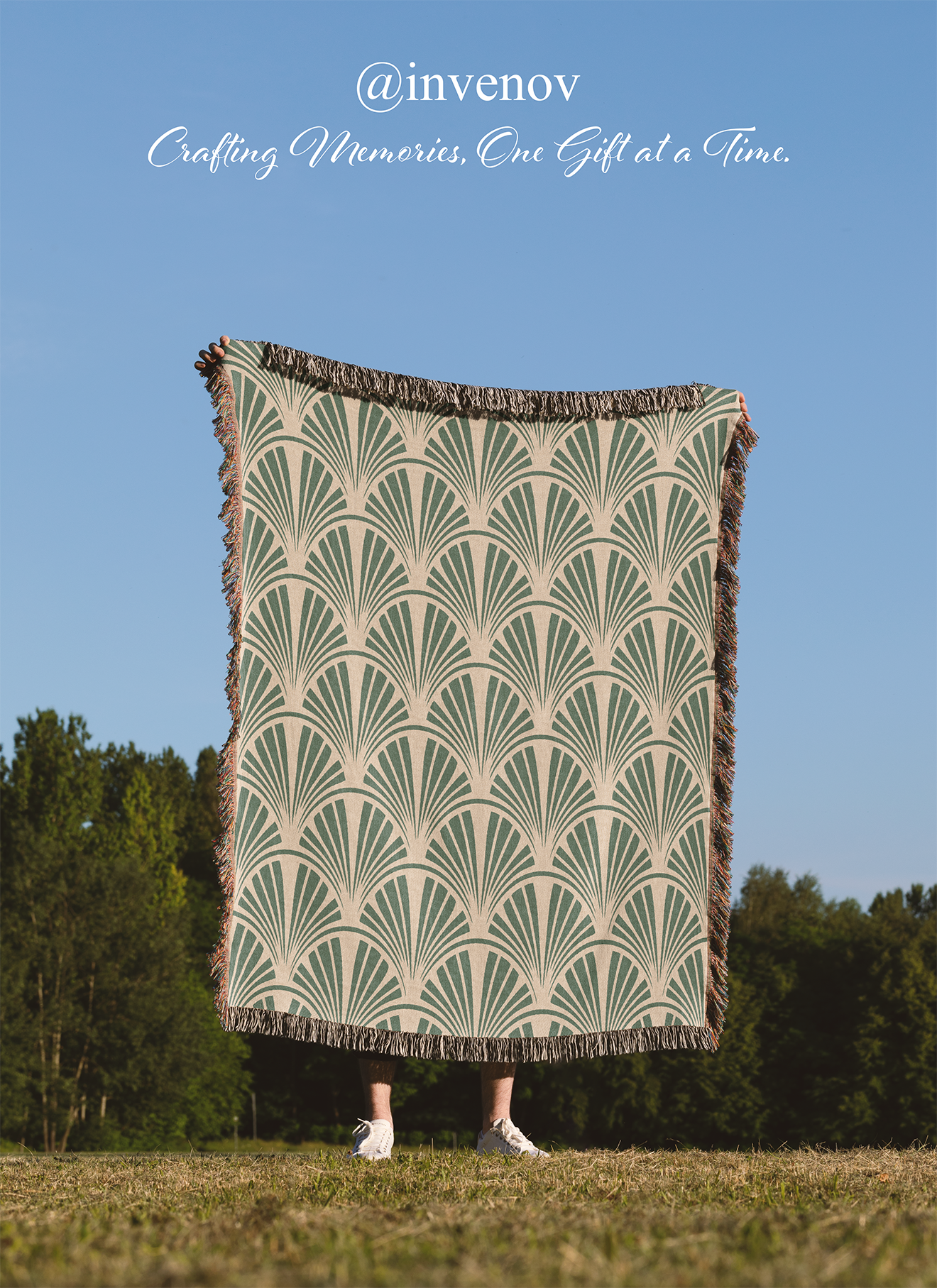 Person holding a patterned blanket outdoors with 'invenov' branding.