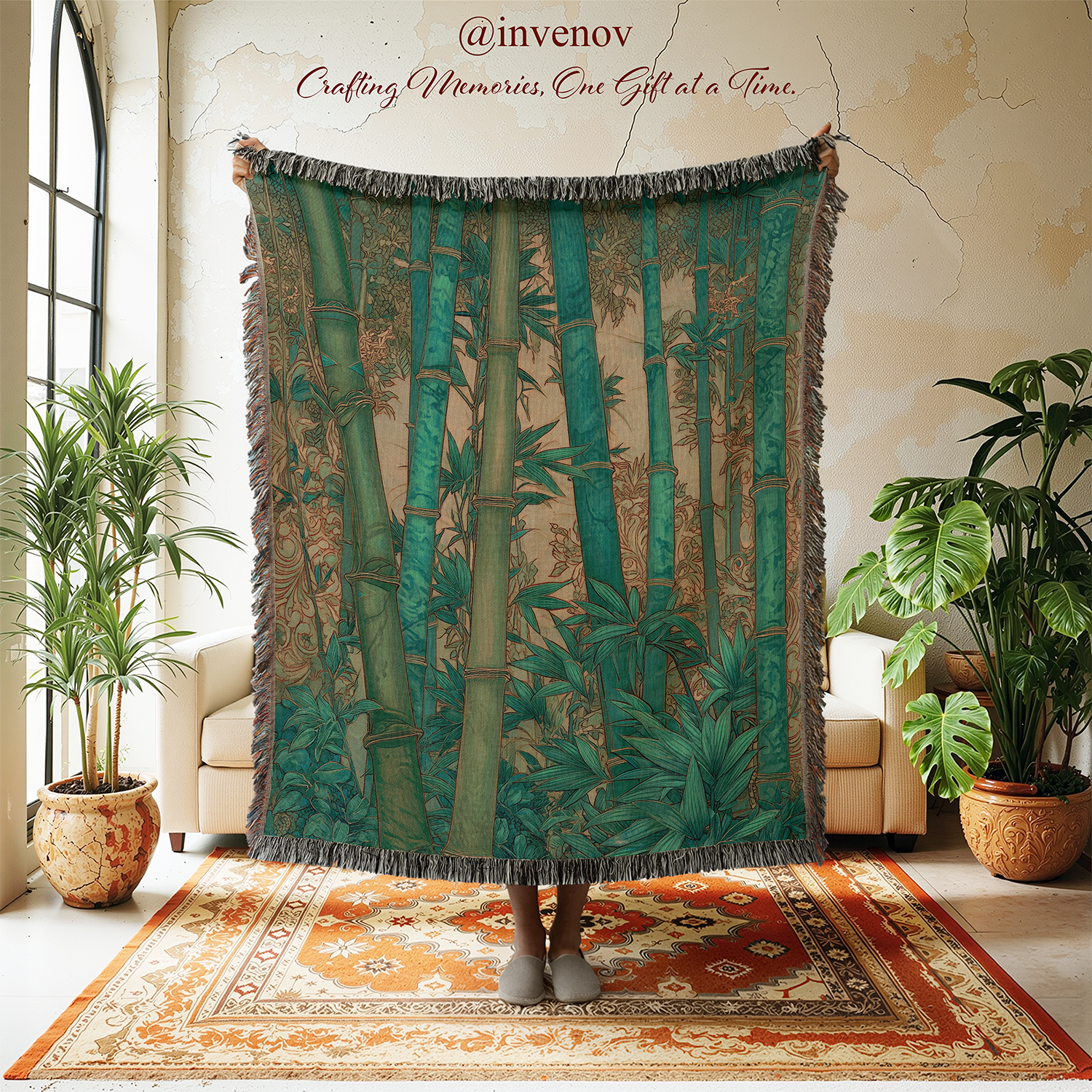 Person holding a bamboo-themed blanket in a room with plants and a couch.