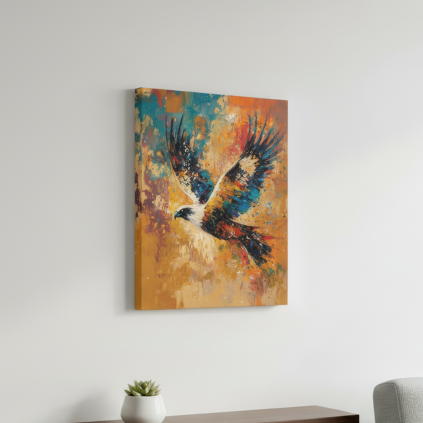 Colorful abstract painting of an eagle on a white wall above a wooden shelf with a plant and a gray chair.