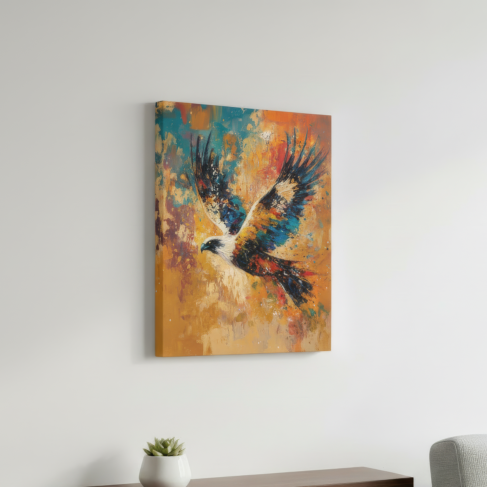 Colorful abstract painting of an eagle on a white wall above a wooden shelf with a plant and a gray chair.