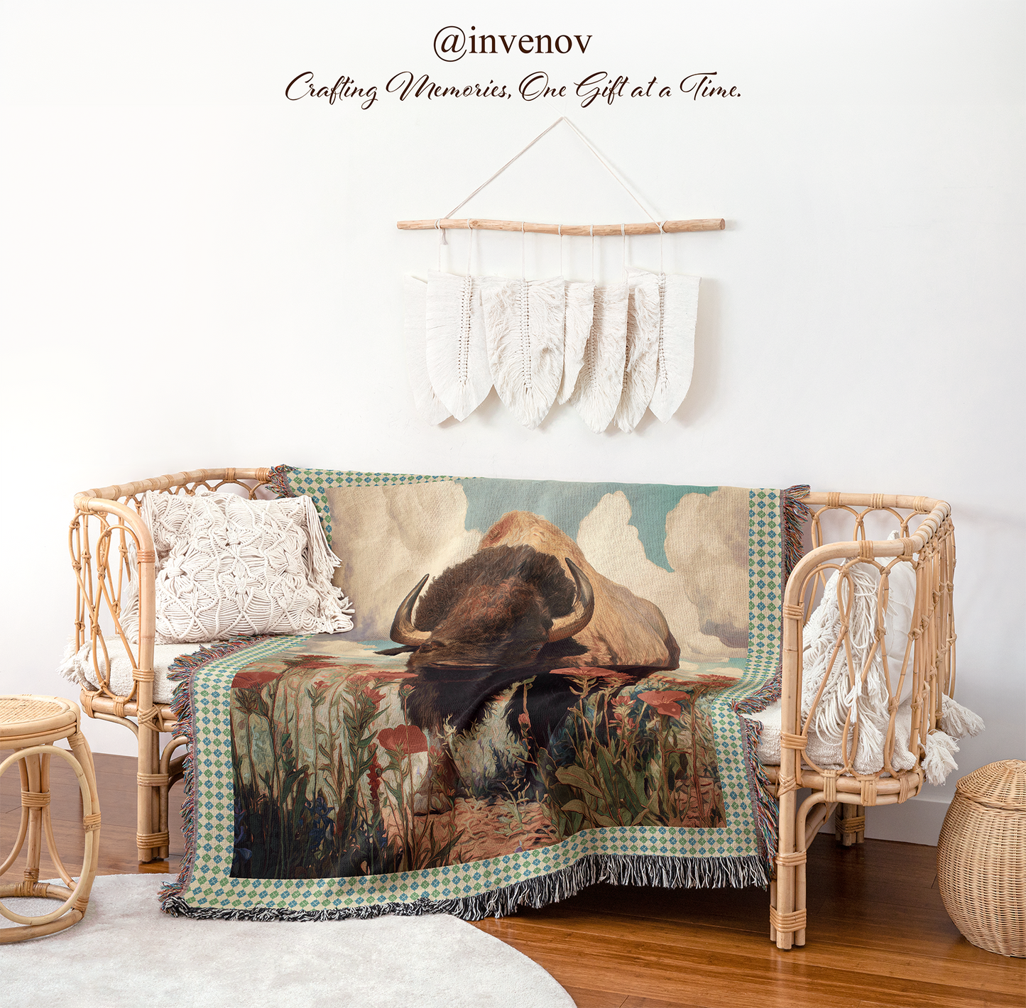 Woven blanket with nature-themed design draped over a wicker chair