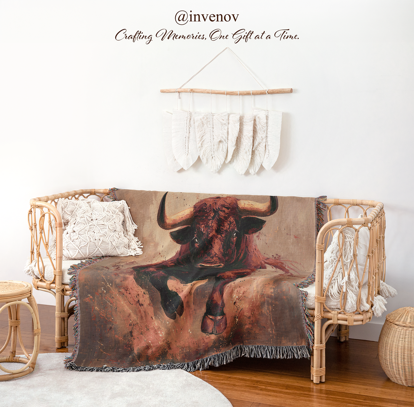 Decorative blanket with a bull design draped over a wicker chair in a room setting.