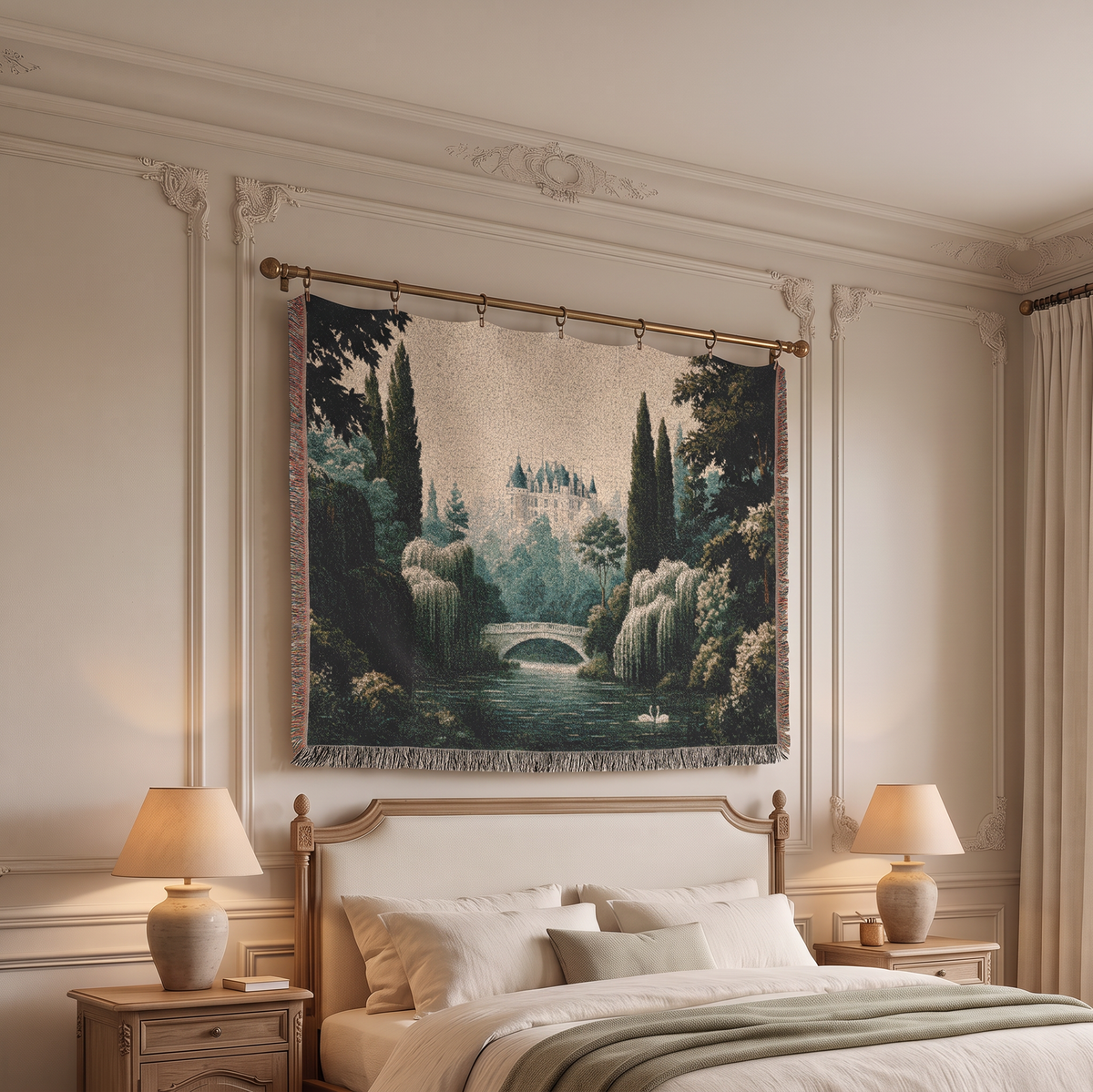 A large woven tapestry featuring a scenic landscape with a castle, bridge, trees, and water, hanging on a gold rod above a bed in a styled bedroom.