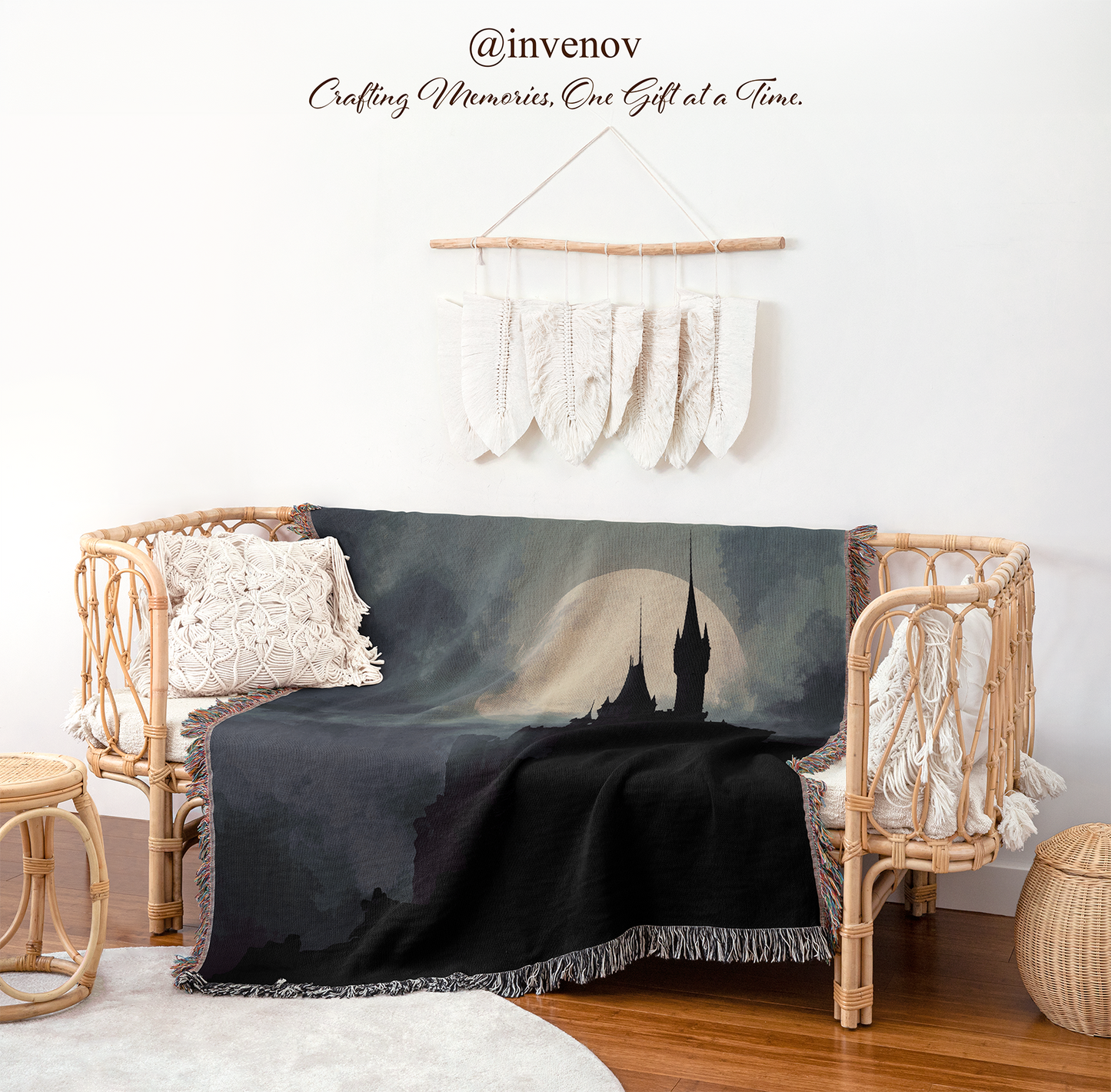 Blanket with castle design draped over a wicker chair