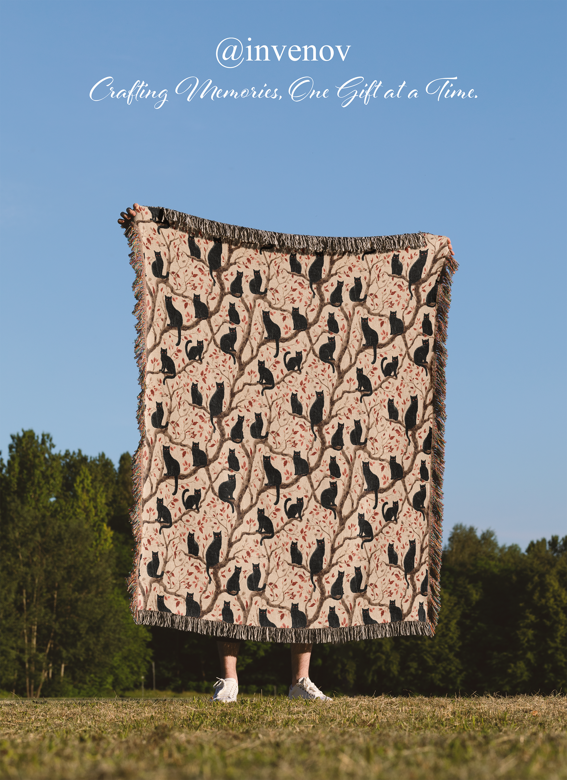 Person holding a patterned blanket outdoors
