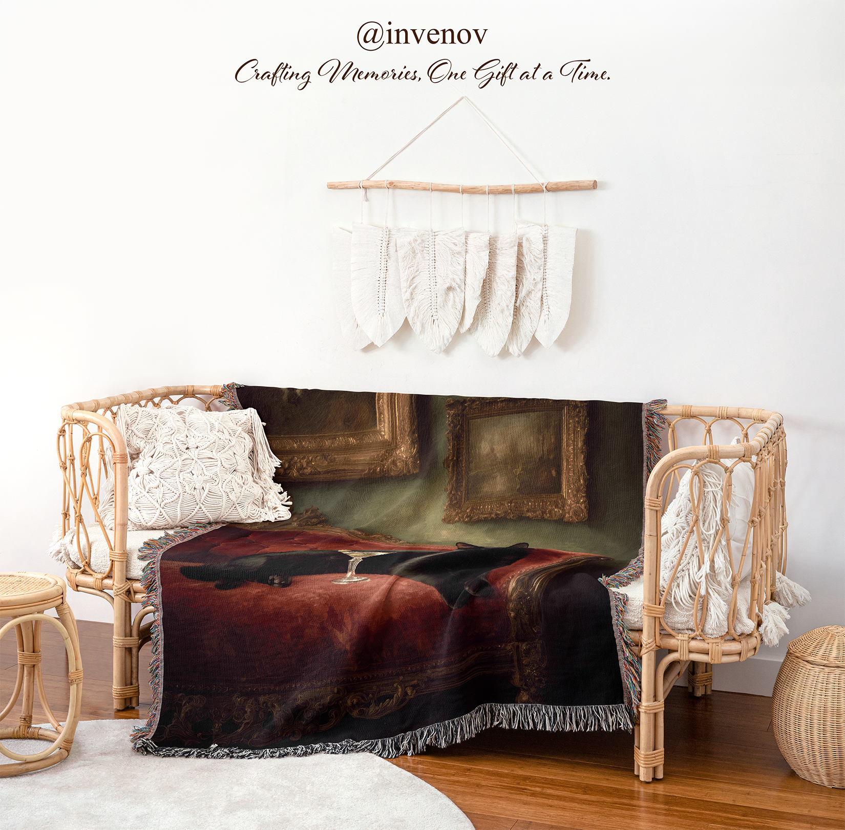 Decorative blanket draped over a chair with a wicker frame, featuring a painting of a cat in a room.