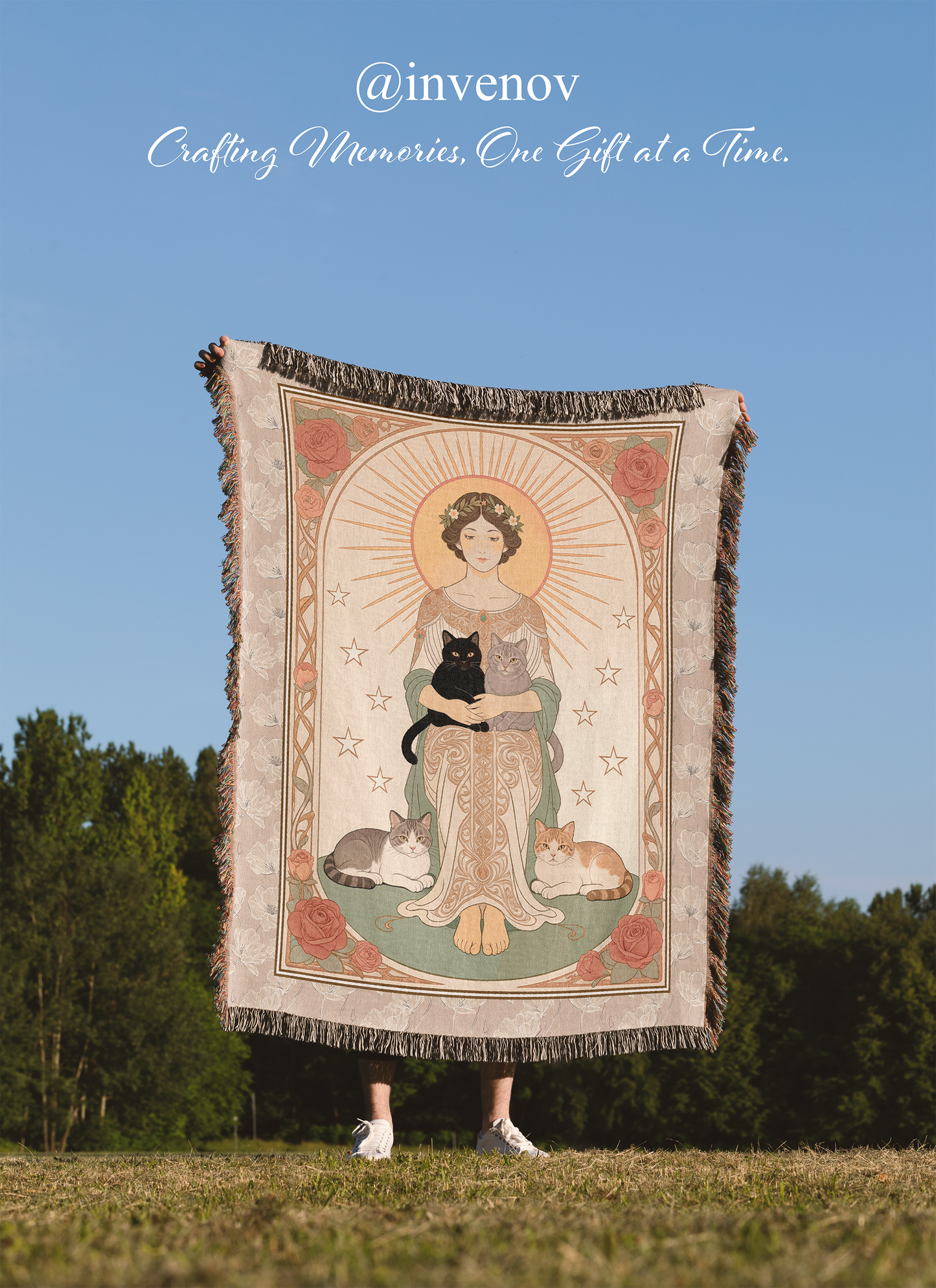 Person holding a tapestry with a woman and animals design against a blue sky and green trees background.