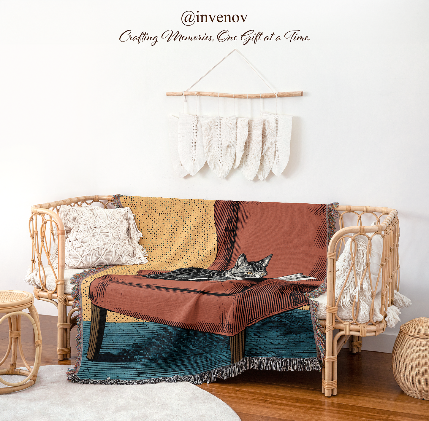 Wicker chair with a blanket draped over it, featuring a cat, against a white wall with decorative elements.