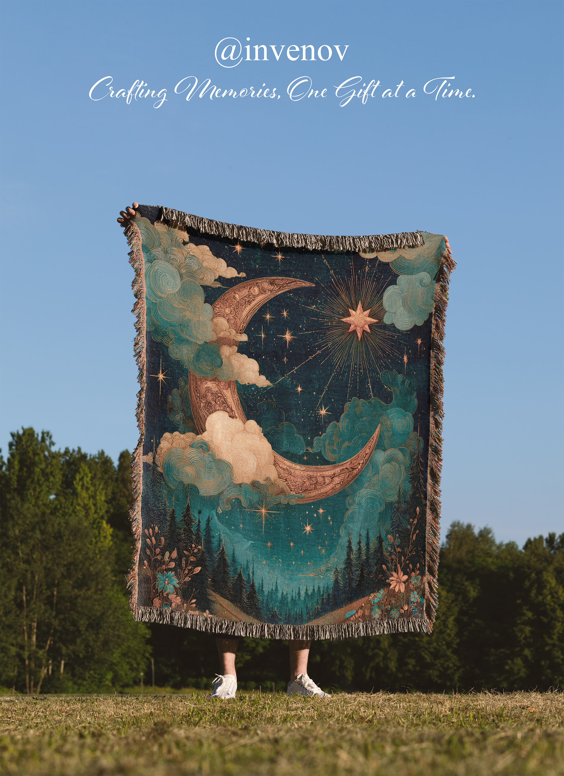 Person holding a decorative blanket with celestial design outdoors