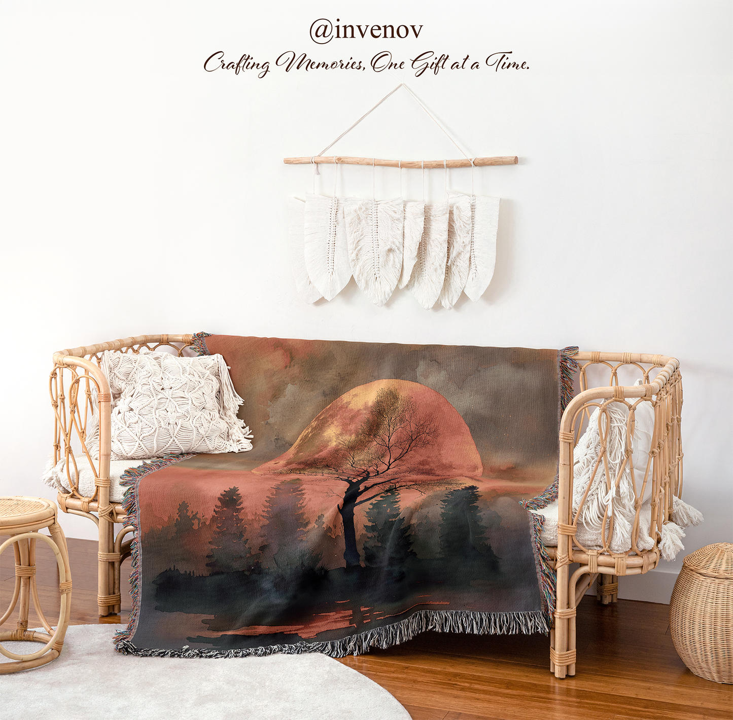 Decorative blanket with a nature scene draped over a wicker chair