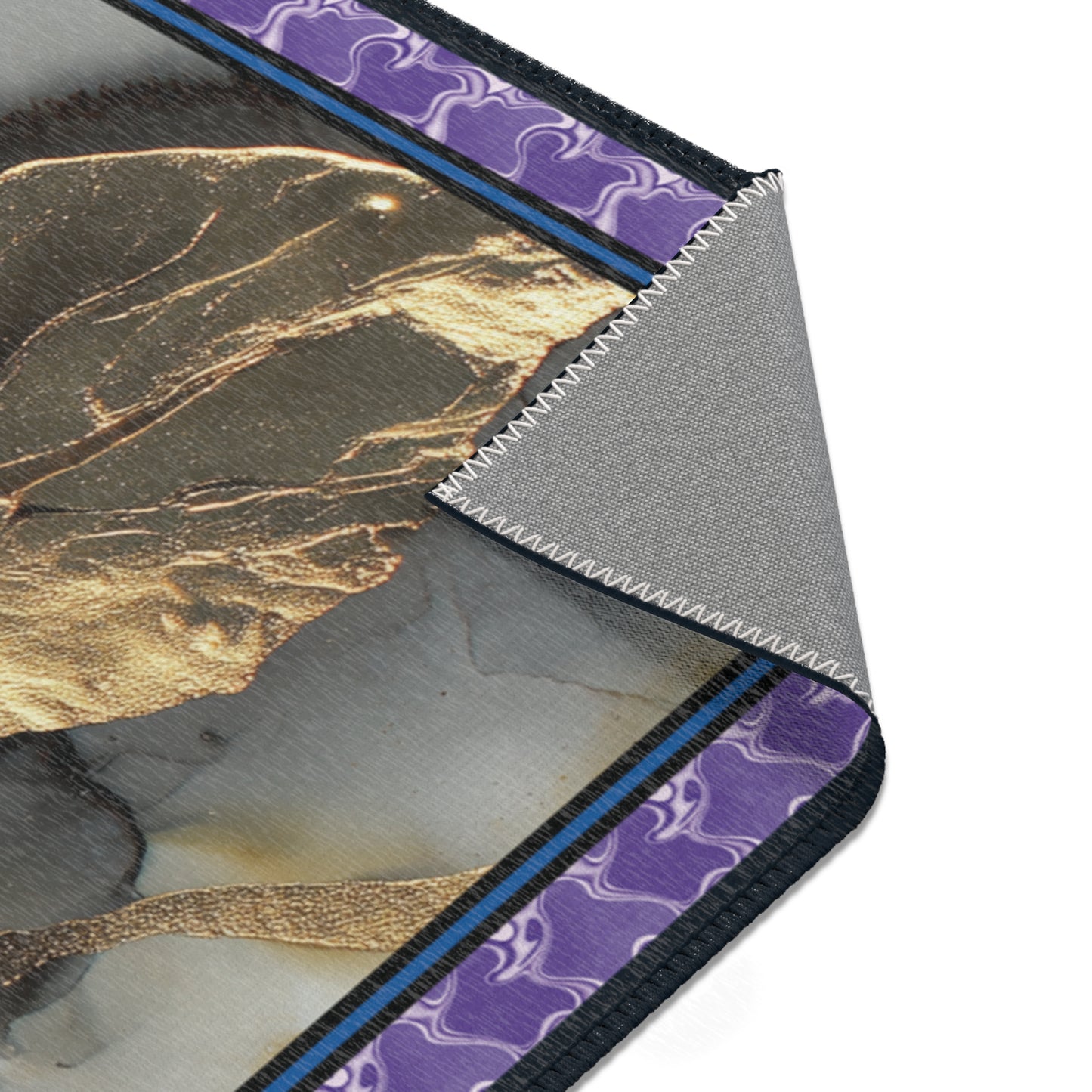 close up of a rug with purple patterns on a white background