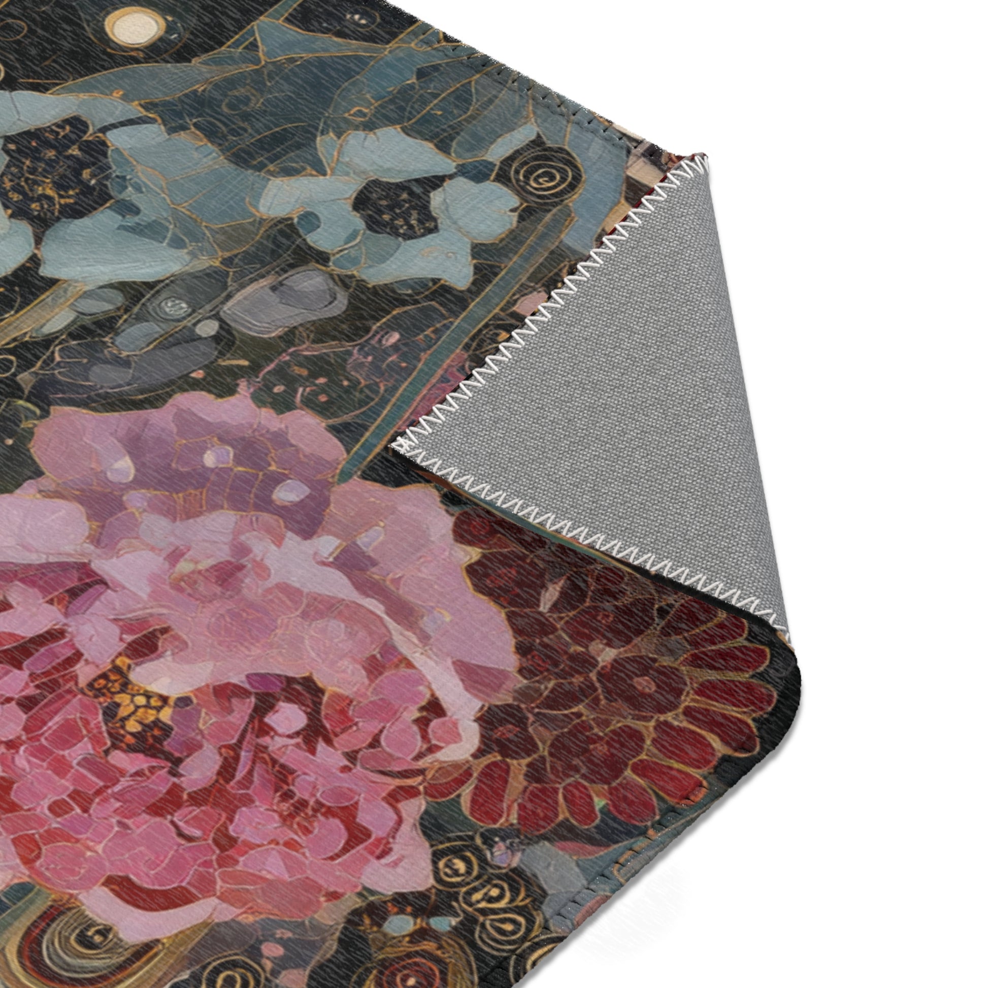 Close-up of a floral-patterned rug with a textured border on a white background