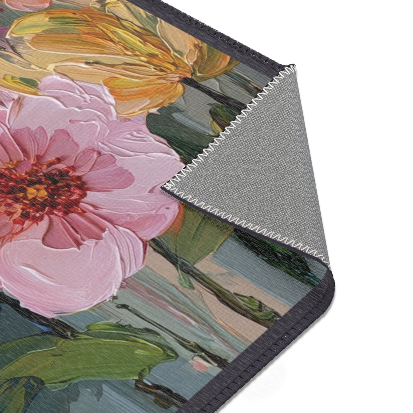 Area Rug with floral design on a product with a gray textured background