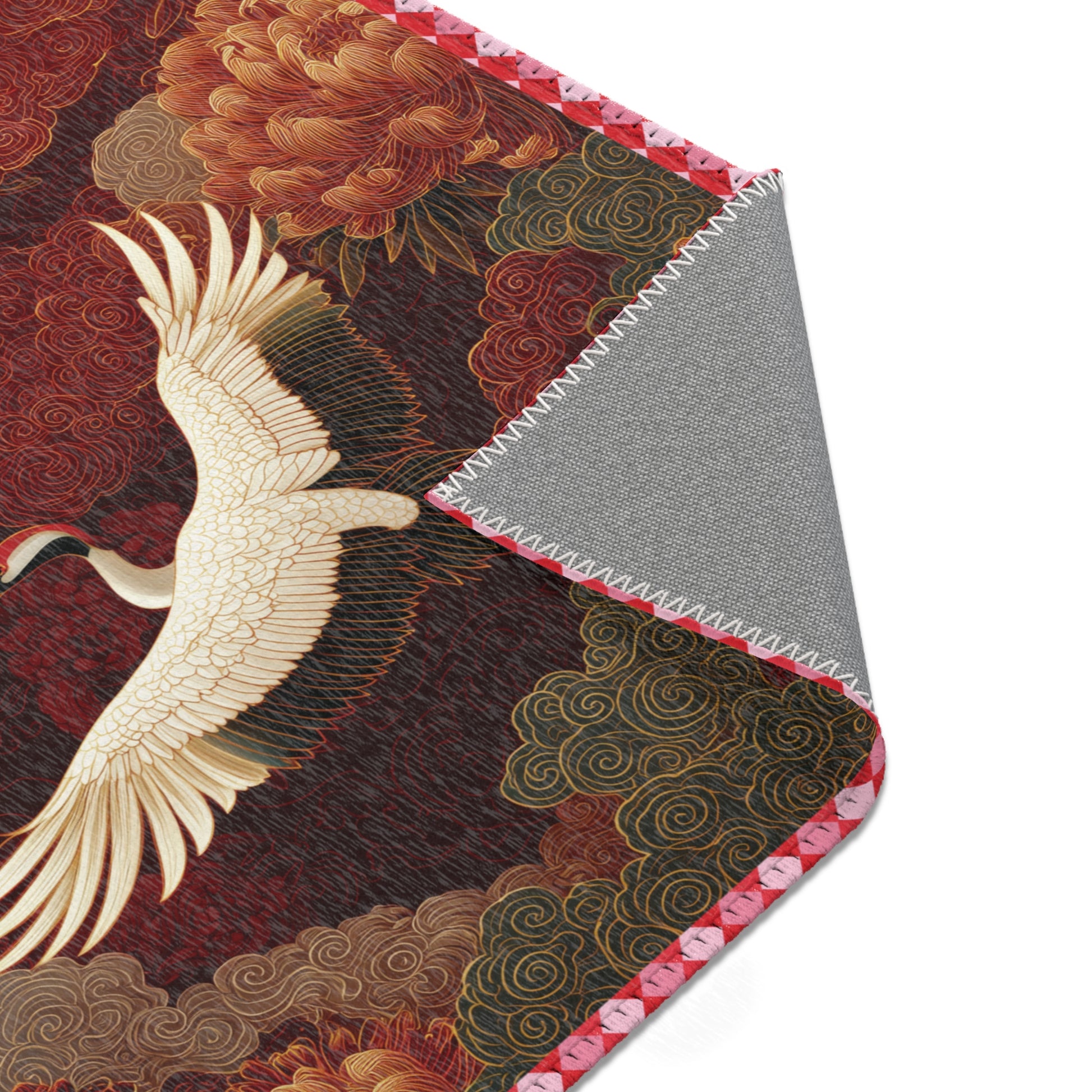 Decorative fabric swatch with a crane design on a textured background