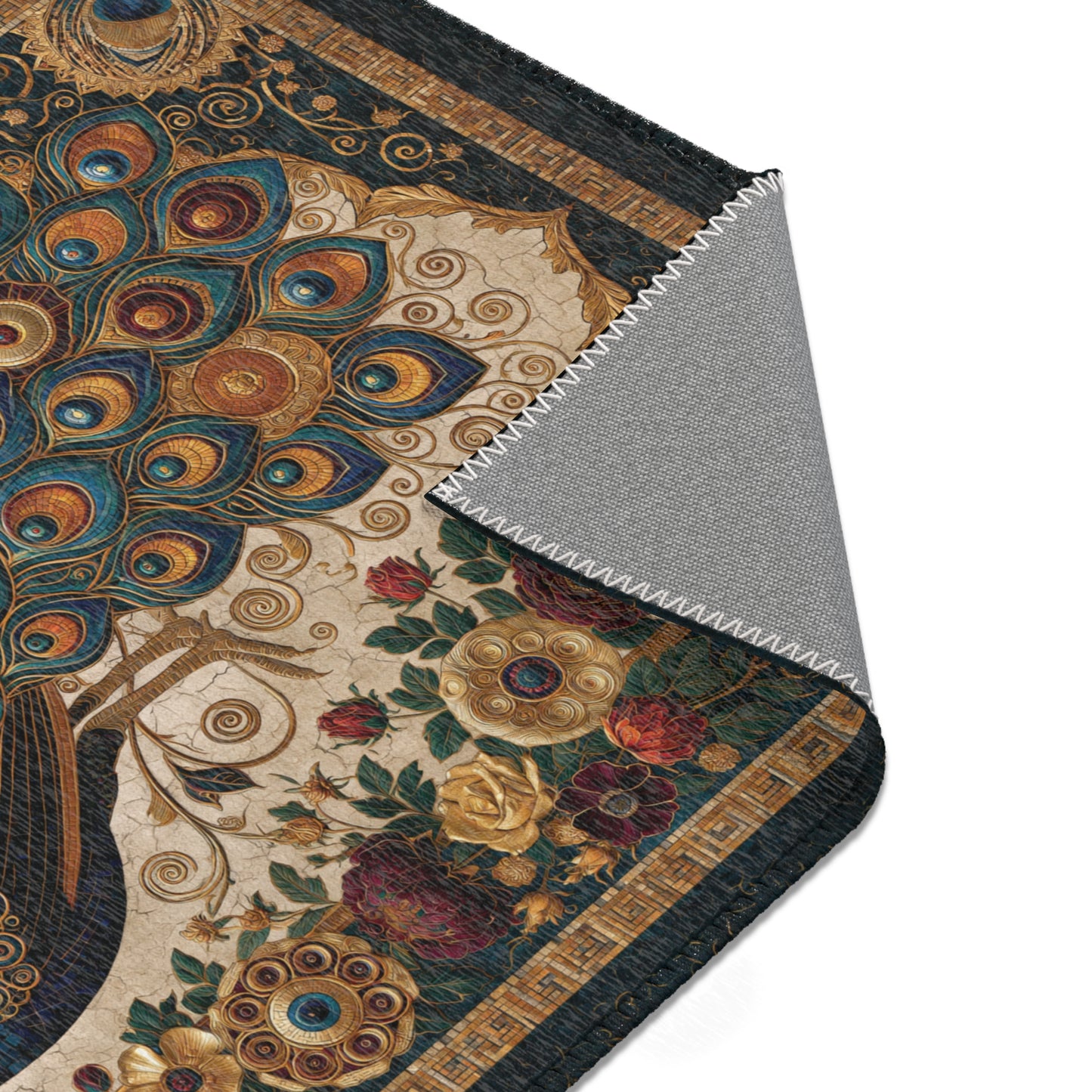 Close-up of an area rug with peacock design and floral elements.