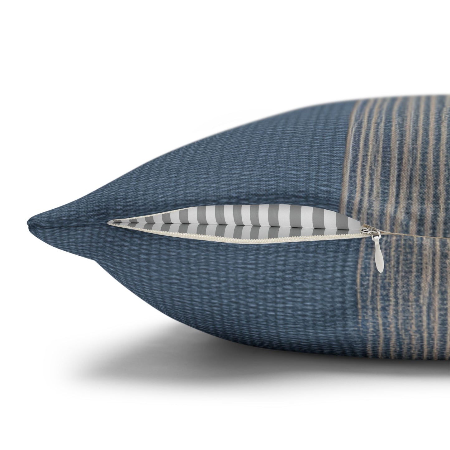 Blue textured pillow with a zipper on a white background