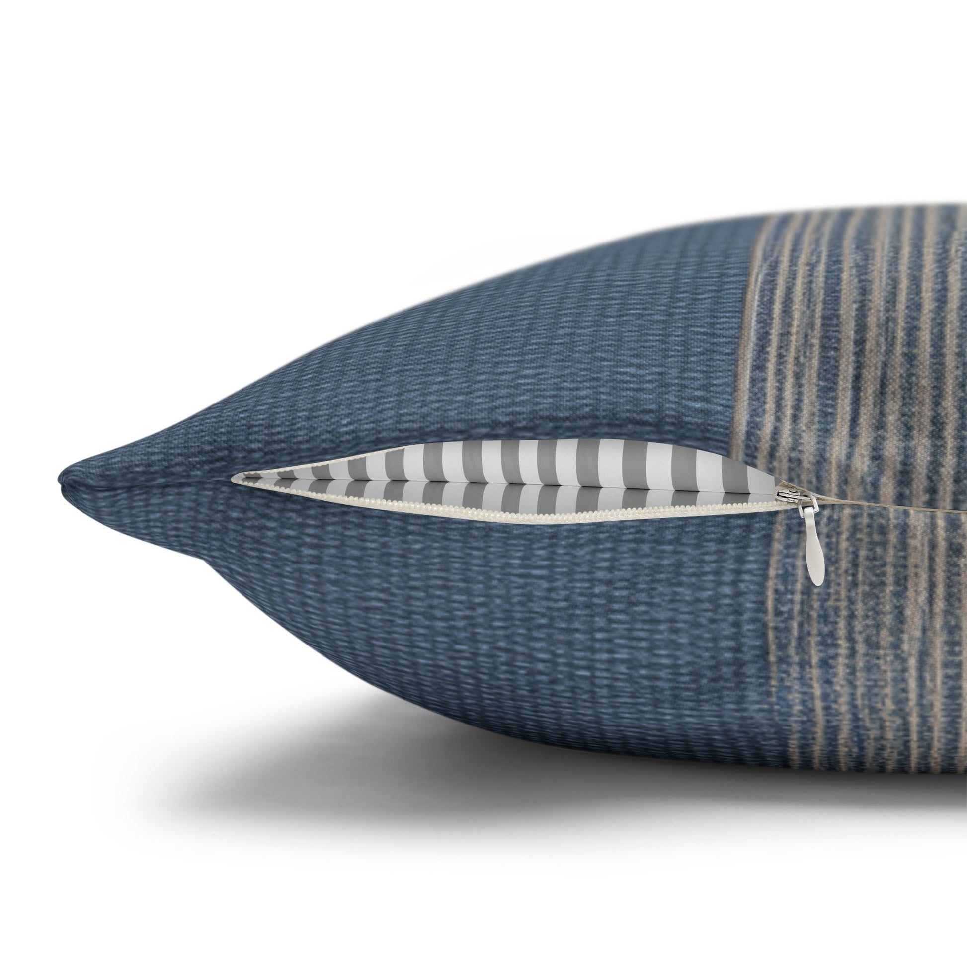 Blue textured pillow with a zipper on a white background
