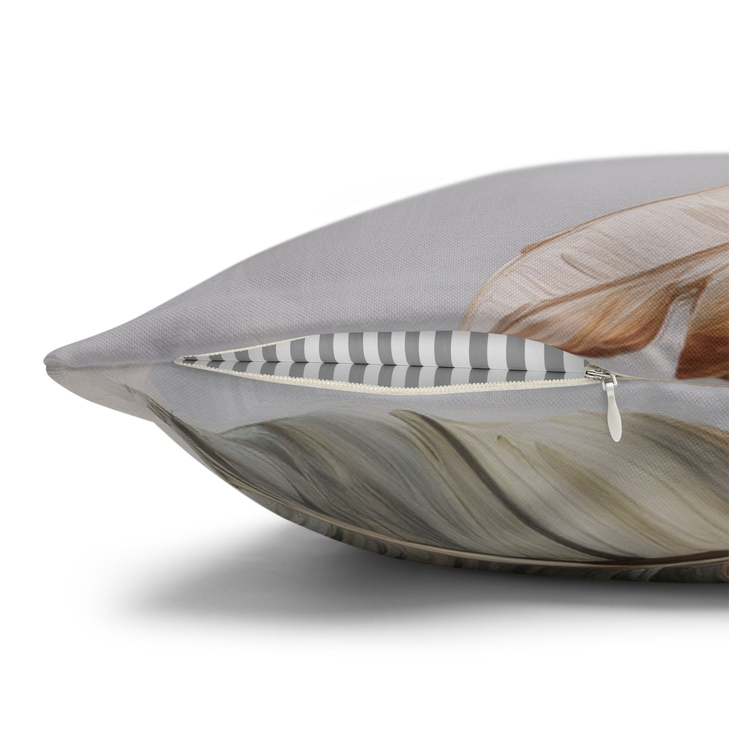 Decorative pillow with feather pattern on a gray background