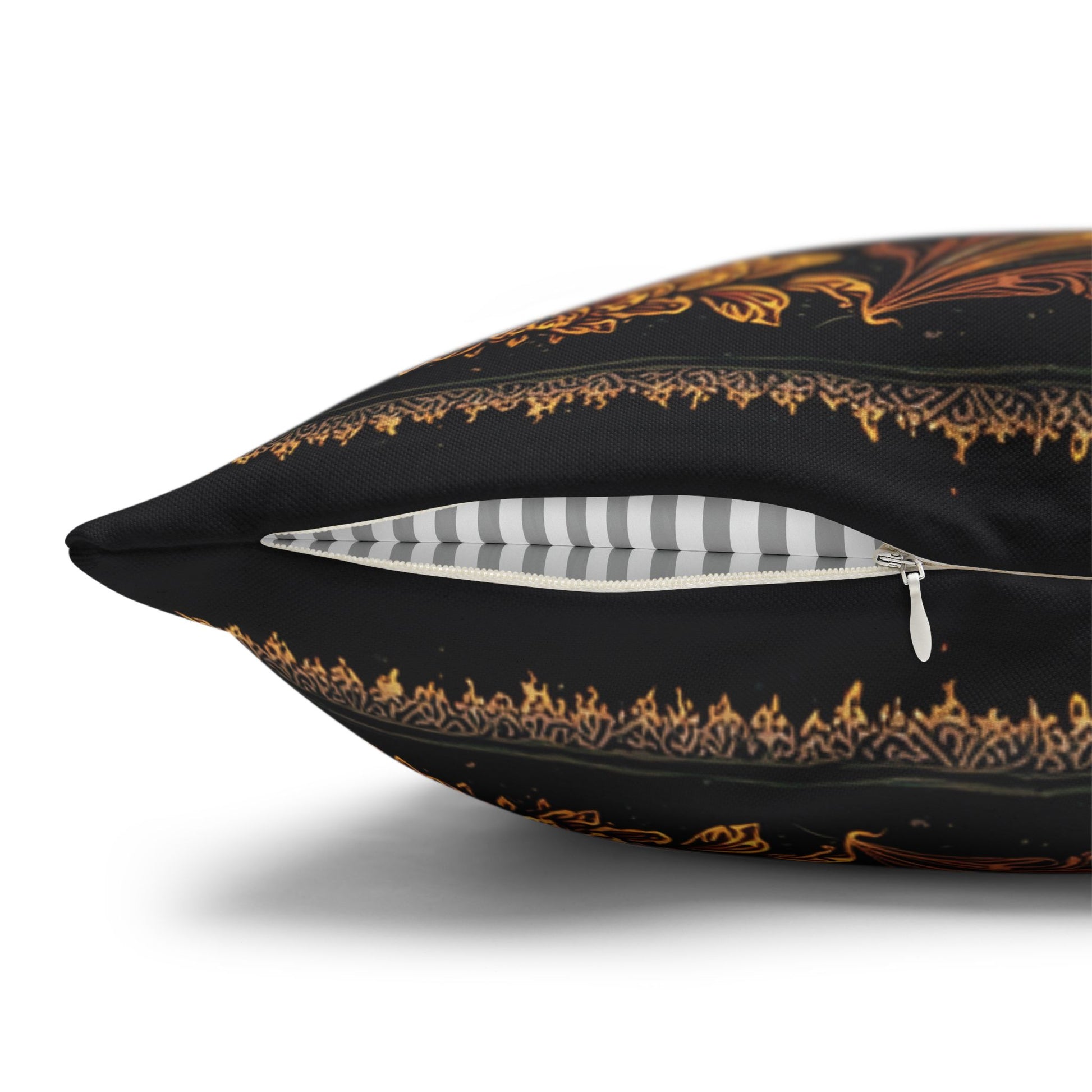 Decorative pillow with gold patterns on a black background