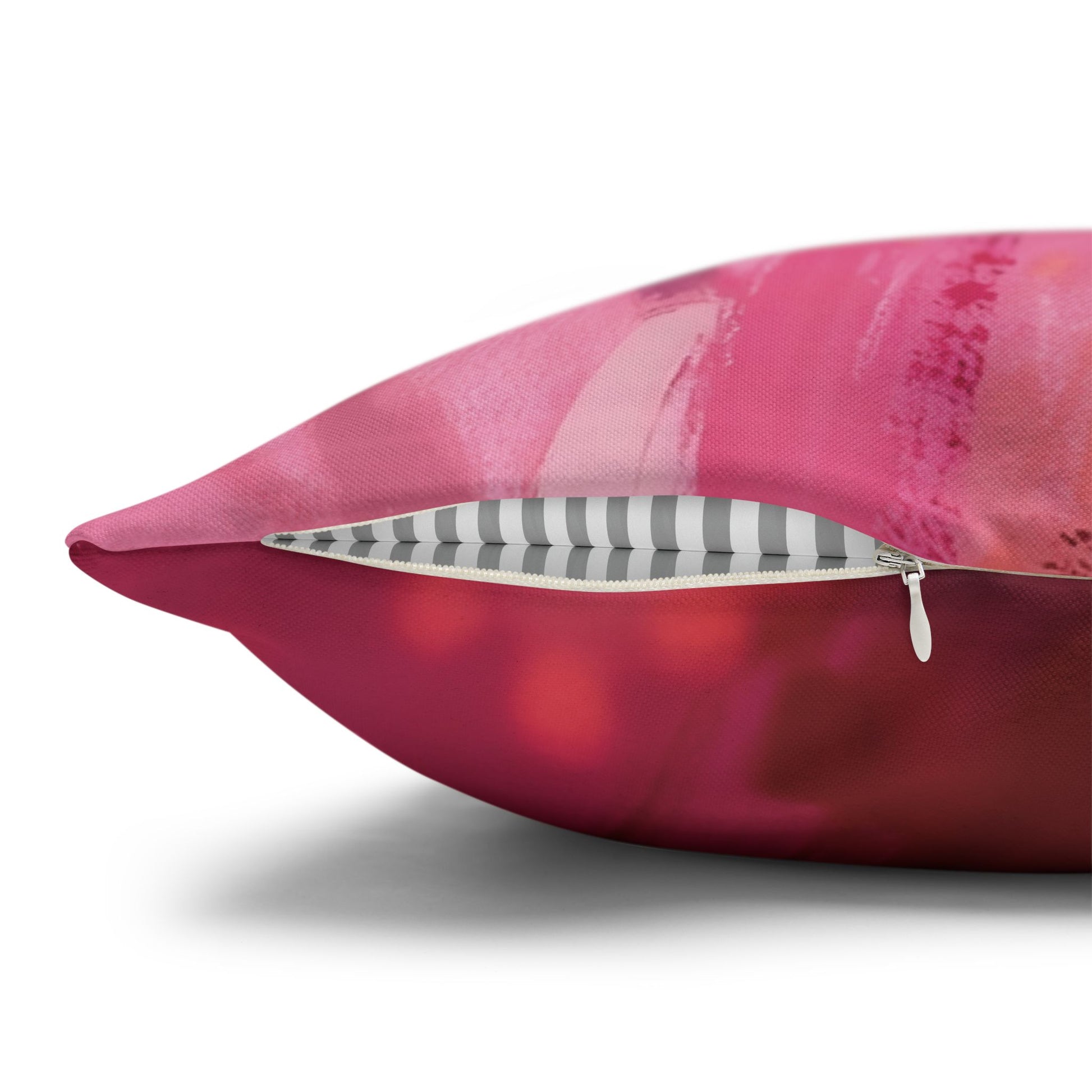 Pink pillow with a zipper on a white background
