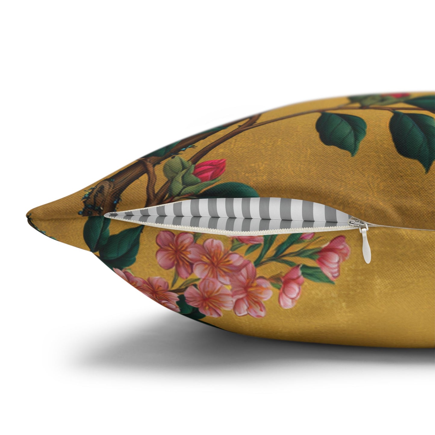 Floral-patterned pillow with a zipper on a white background