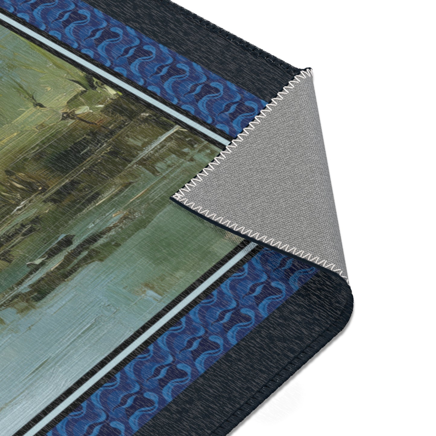 Close-up of an area rug with blue and black patterns on a white background