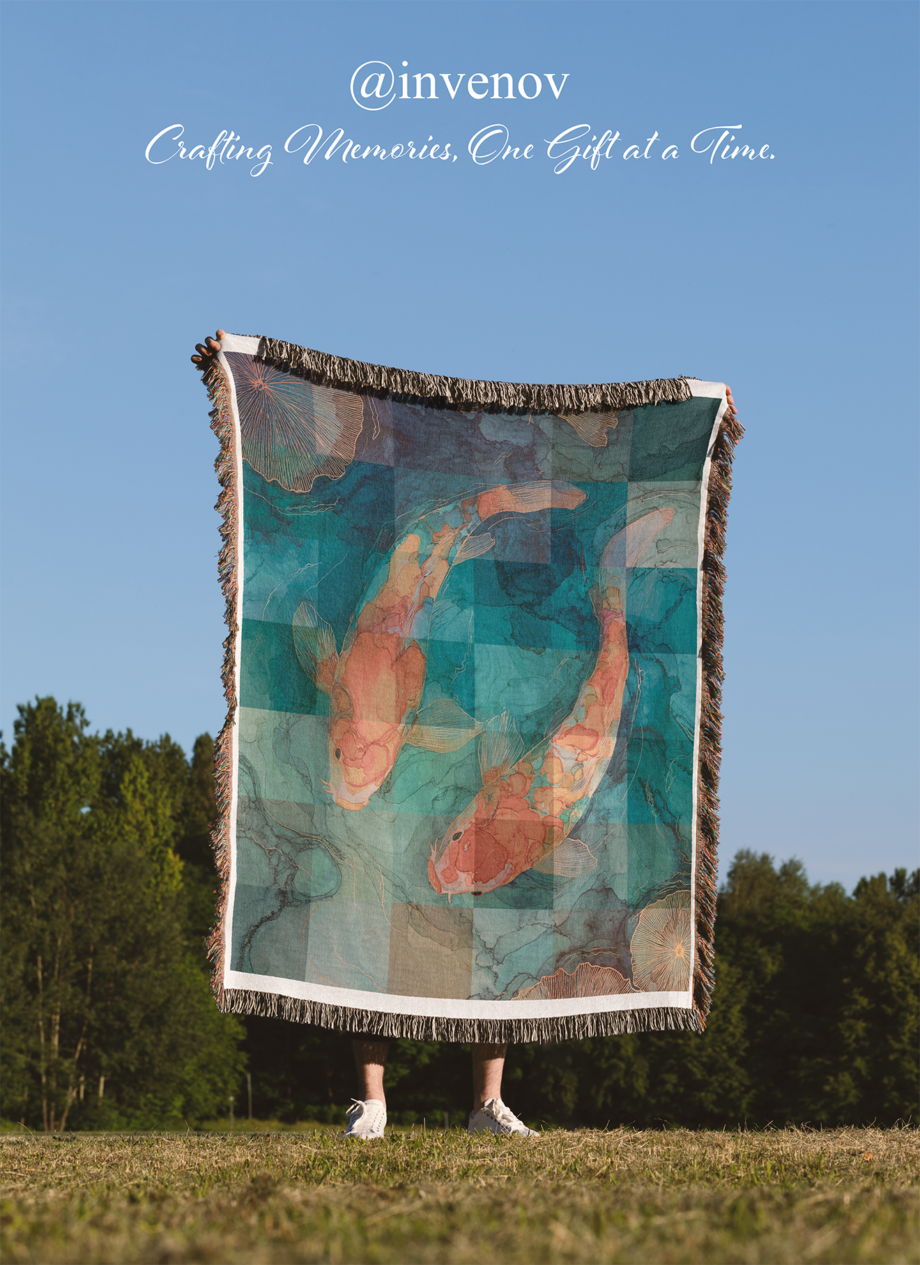 Person holding a decorative blanket with koi fish design outdoors