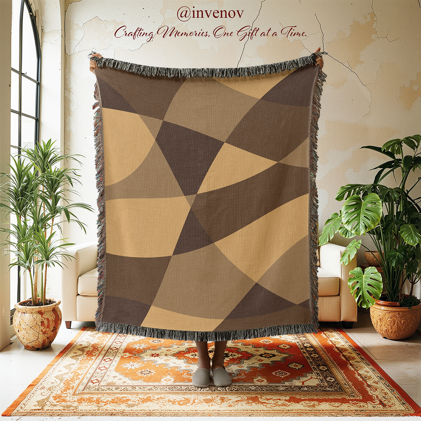 Geometric patterned throw blanket in a room with plants and a rug.