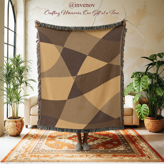 Geometric patterned throw blanket in a room with plants and a rug.
