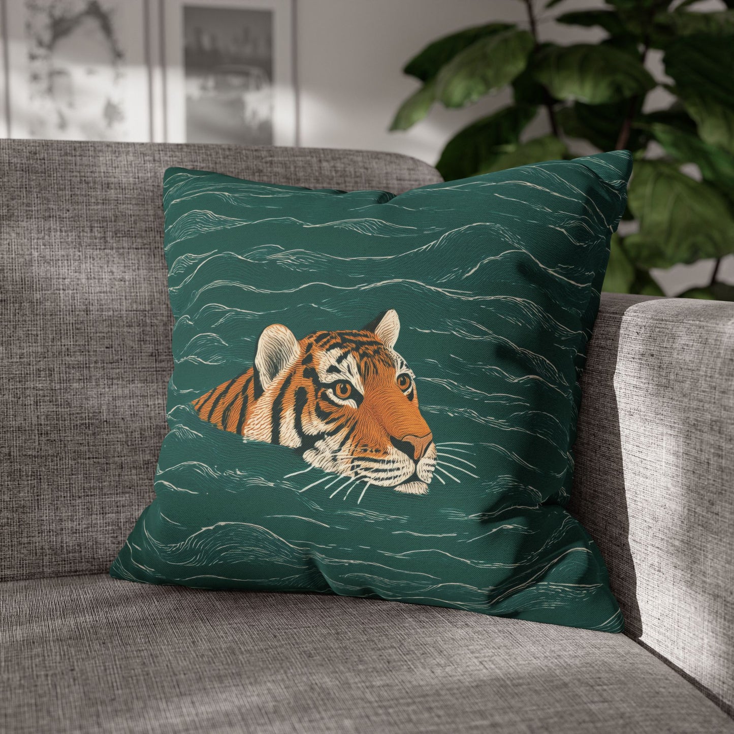 Green pillow with a tiger design on a gray couch