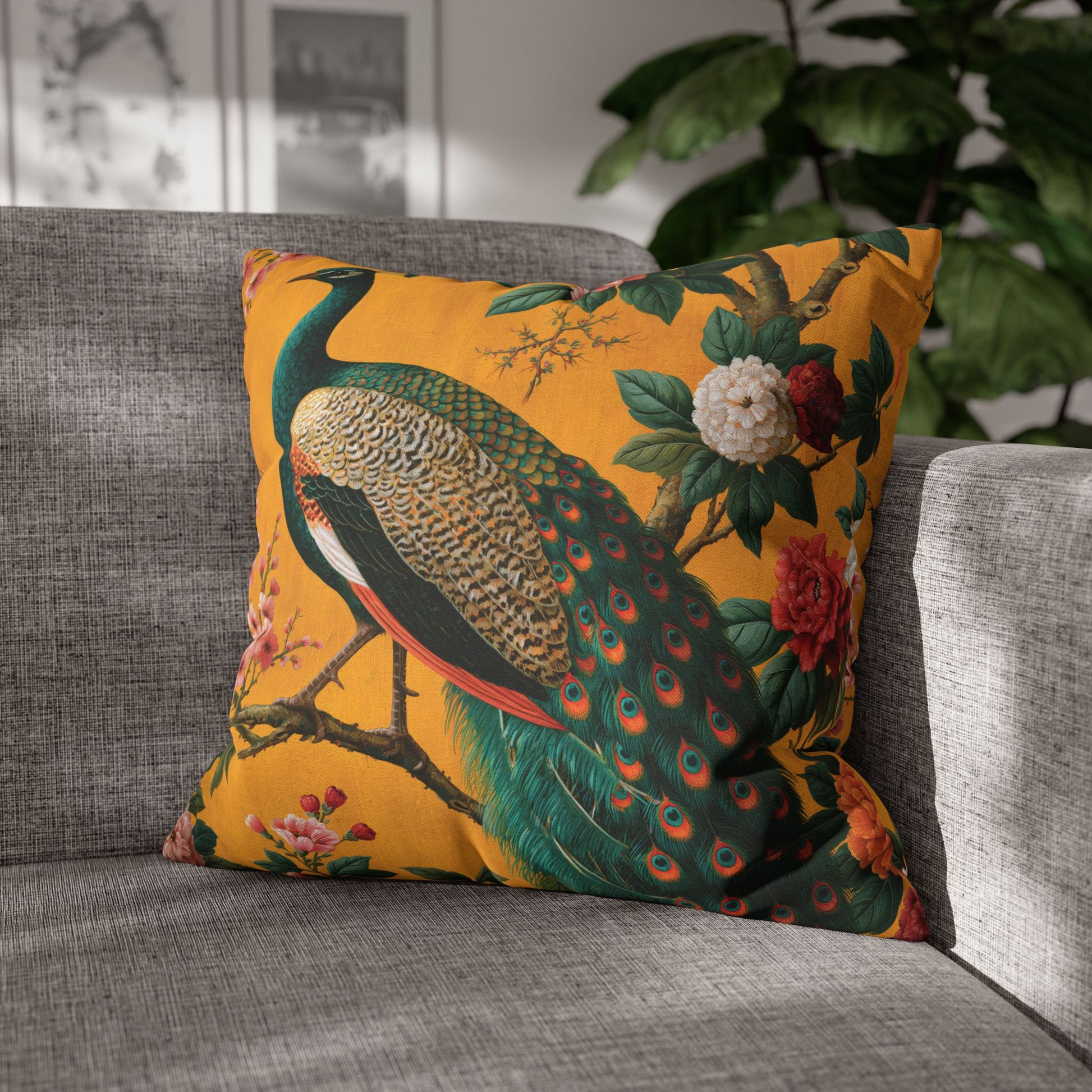 Decorative pillow with peacock design on a gray sofa