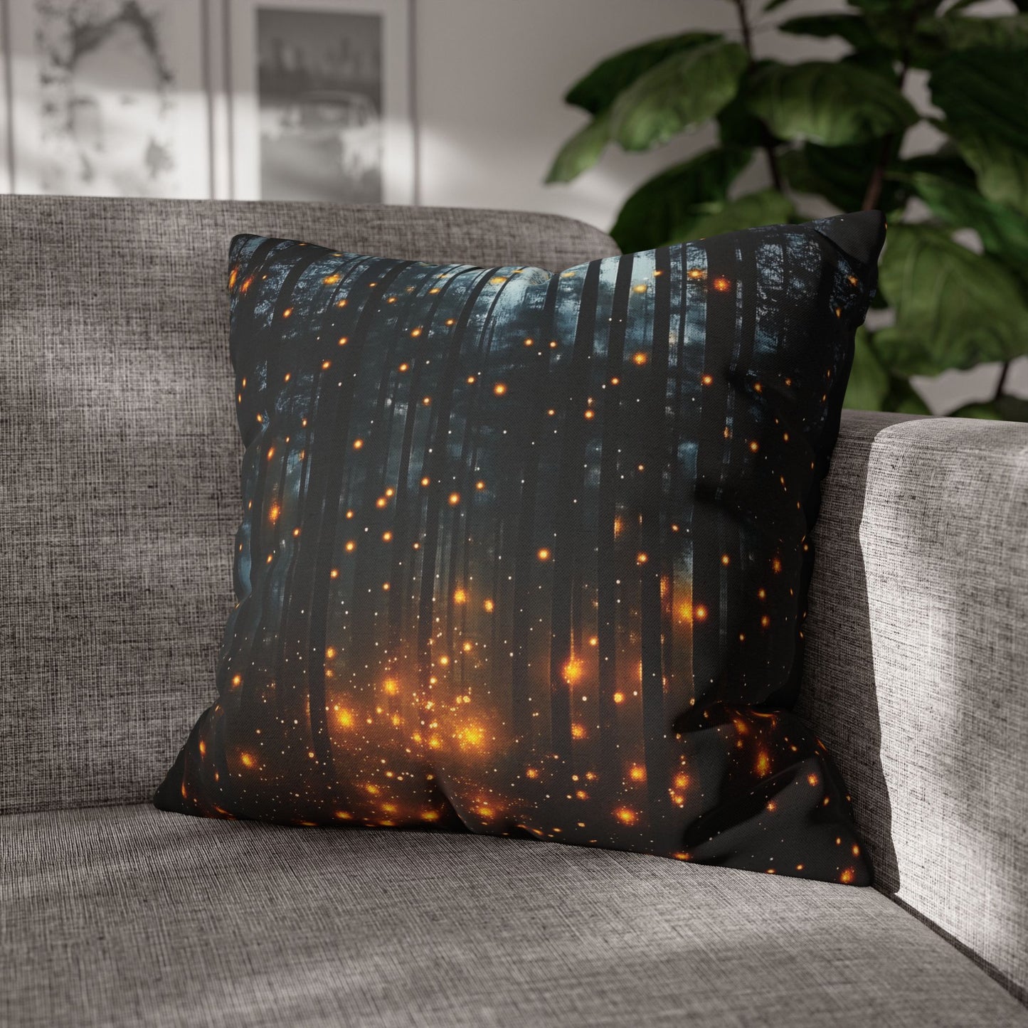Decorative pillow with forest design on a gray sofa