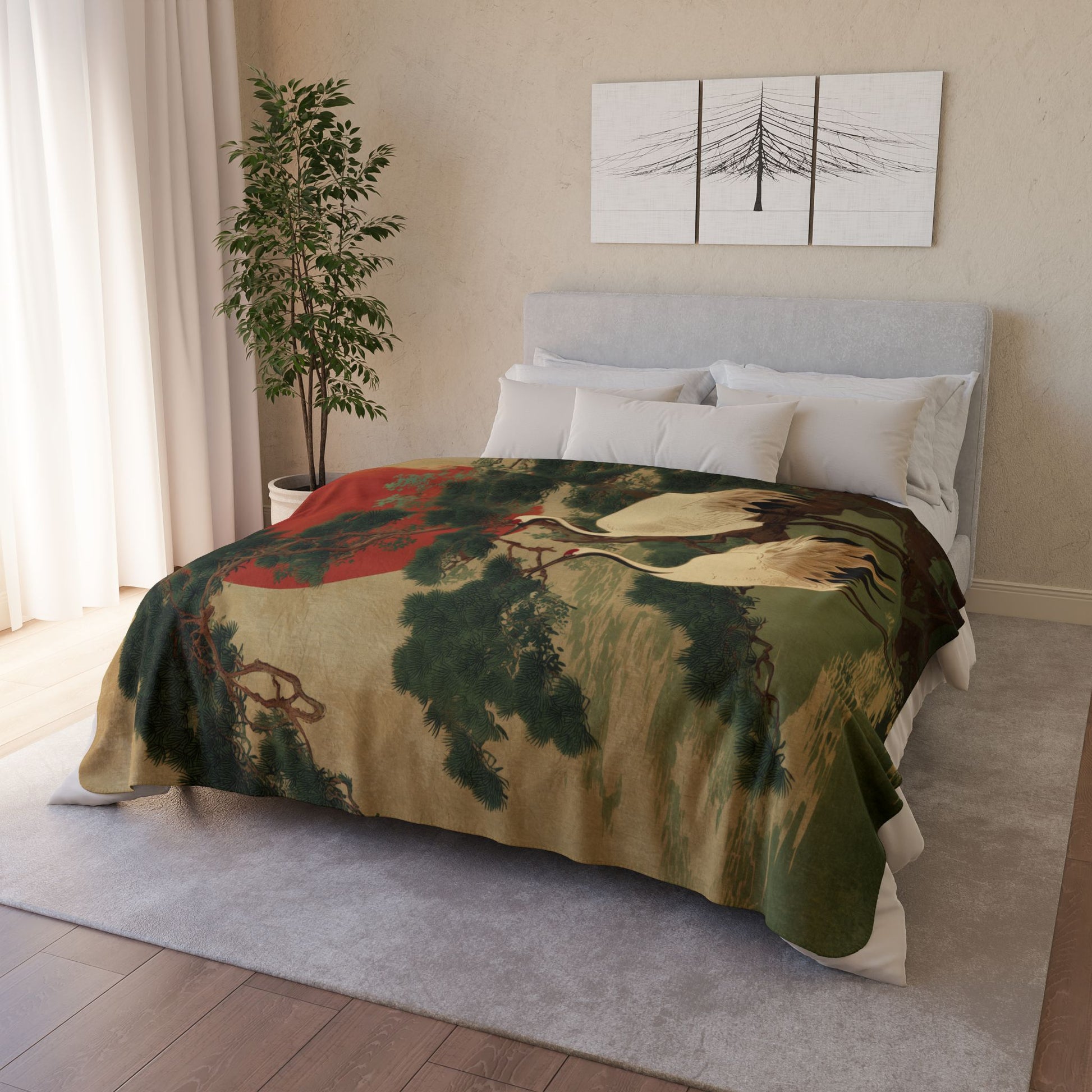 Bedroom with a bed covered by a nature-themed blanket, light-colored walls, and a plant.