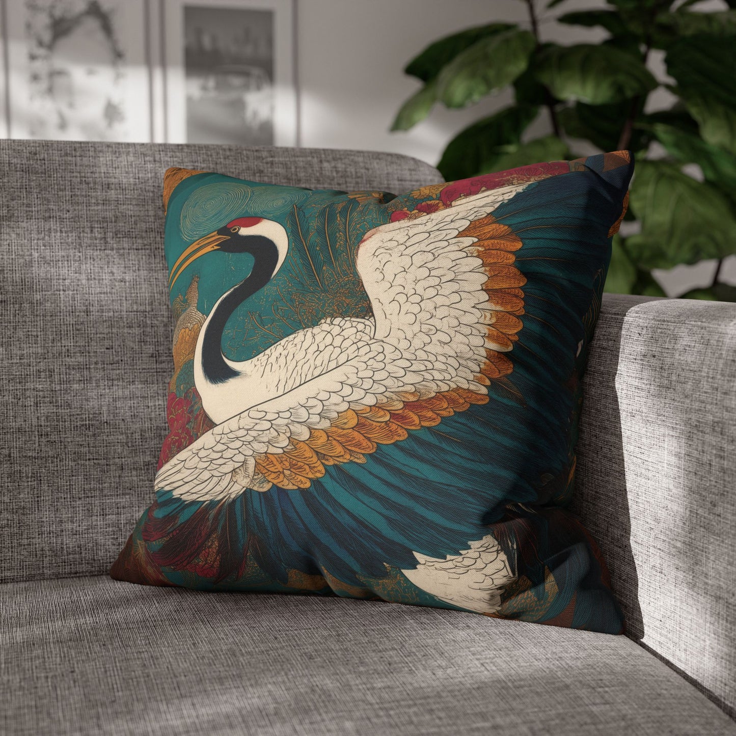 Decorative pillow with a crane design on a gray sofa