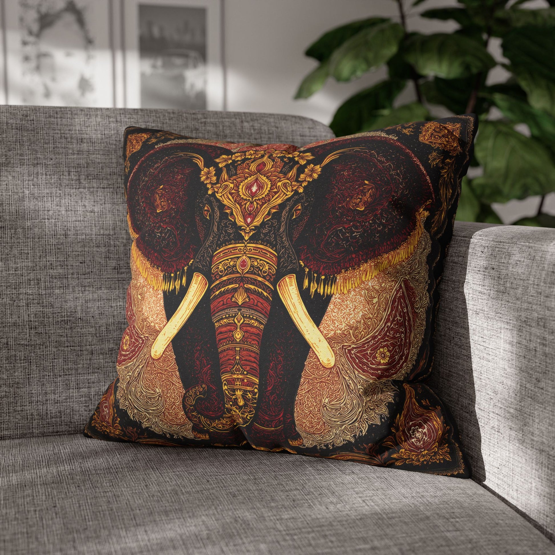 Decorative pillow with elephant design on a gray sofa