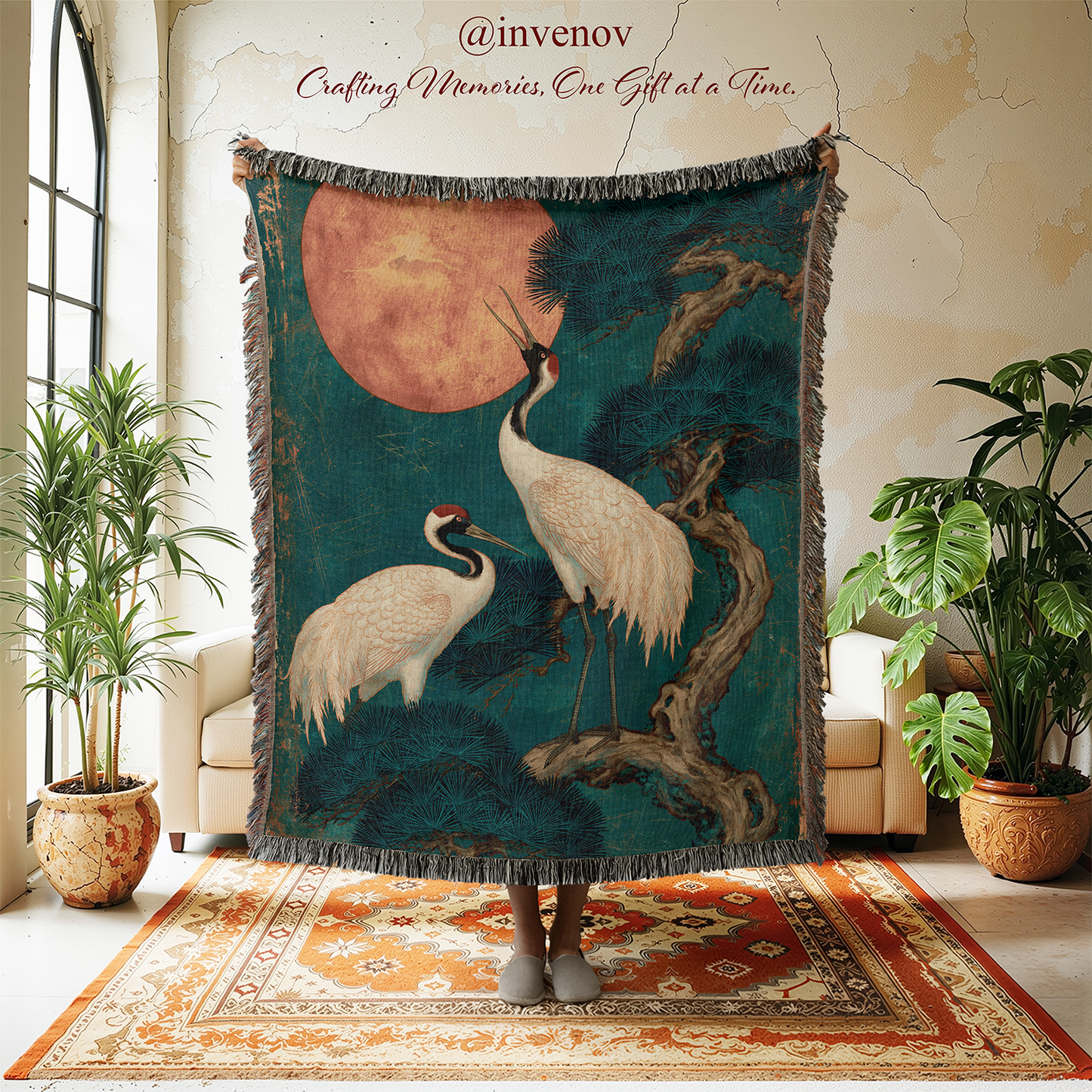 Decorative blanket with crane design in a room with plants and furniture