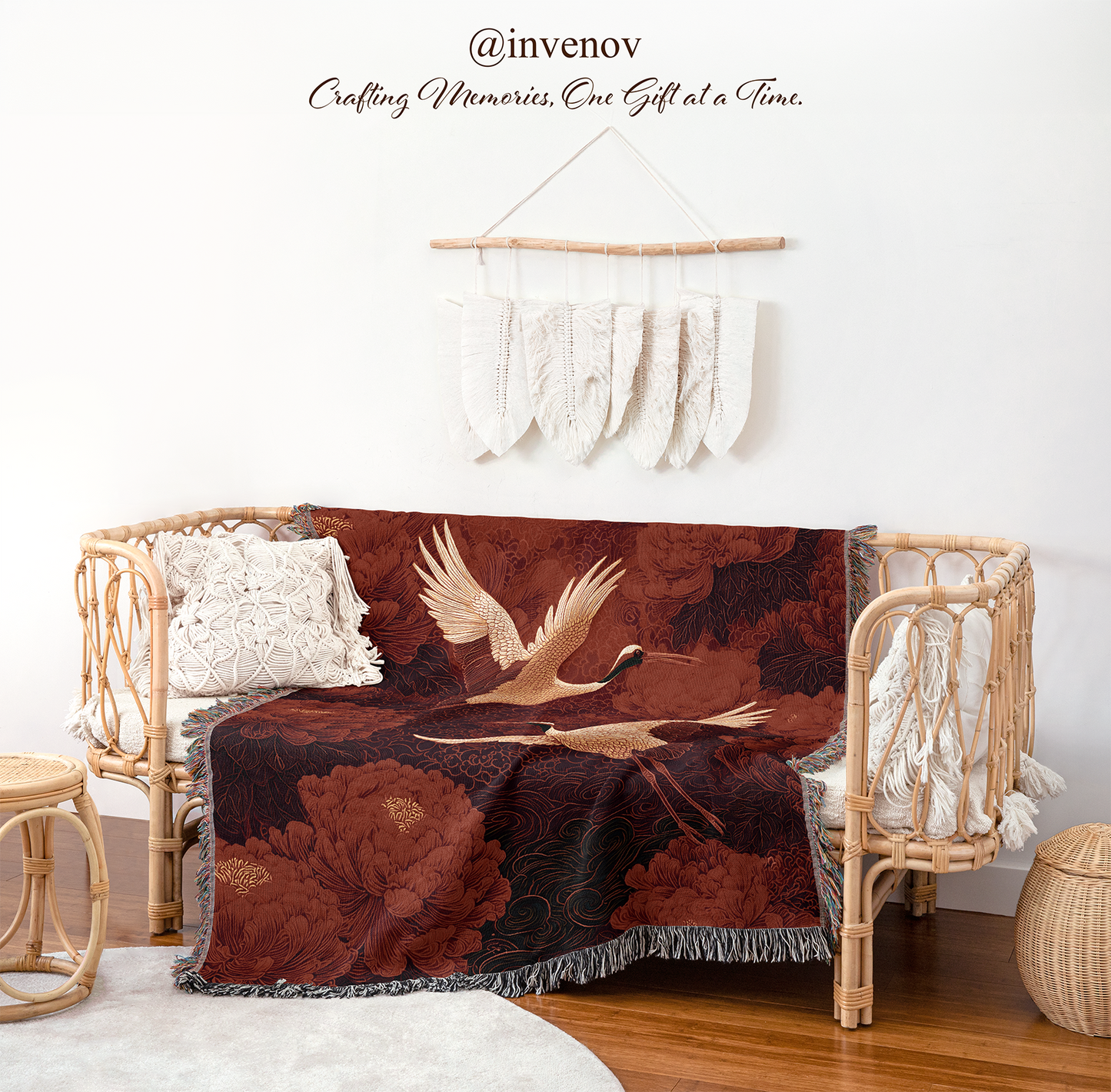 Decorative blanket with bird design draped over a wicker chair