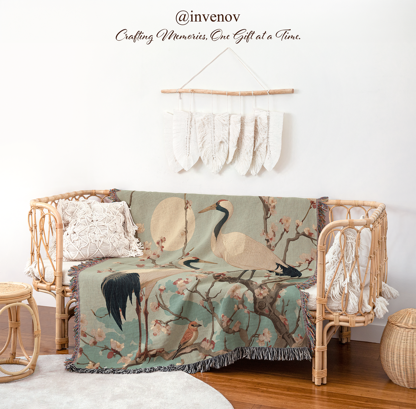 Decorative blanket with bird pattern draped over a chair in a room with wicker furniture.