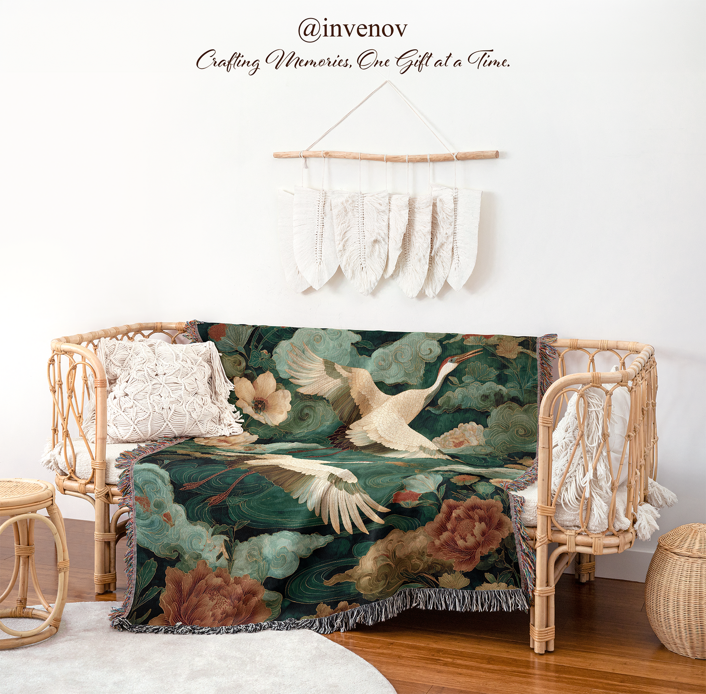 Decorative blanket with bird and floral pattern draped over a wicker chair