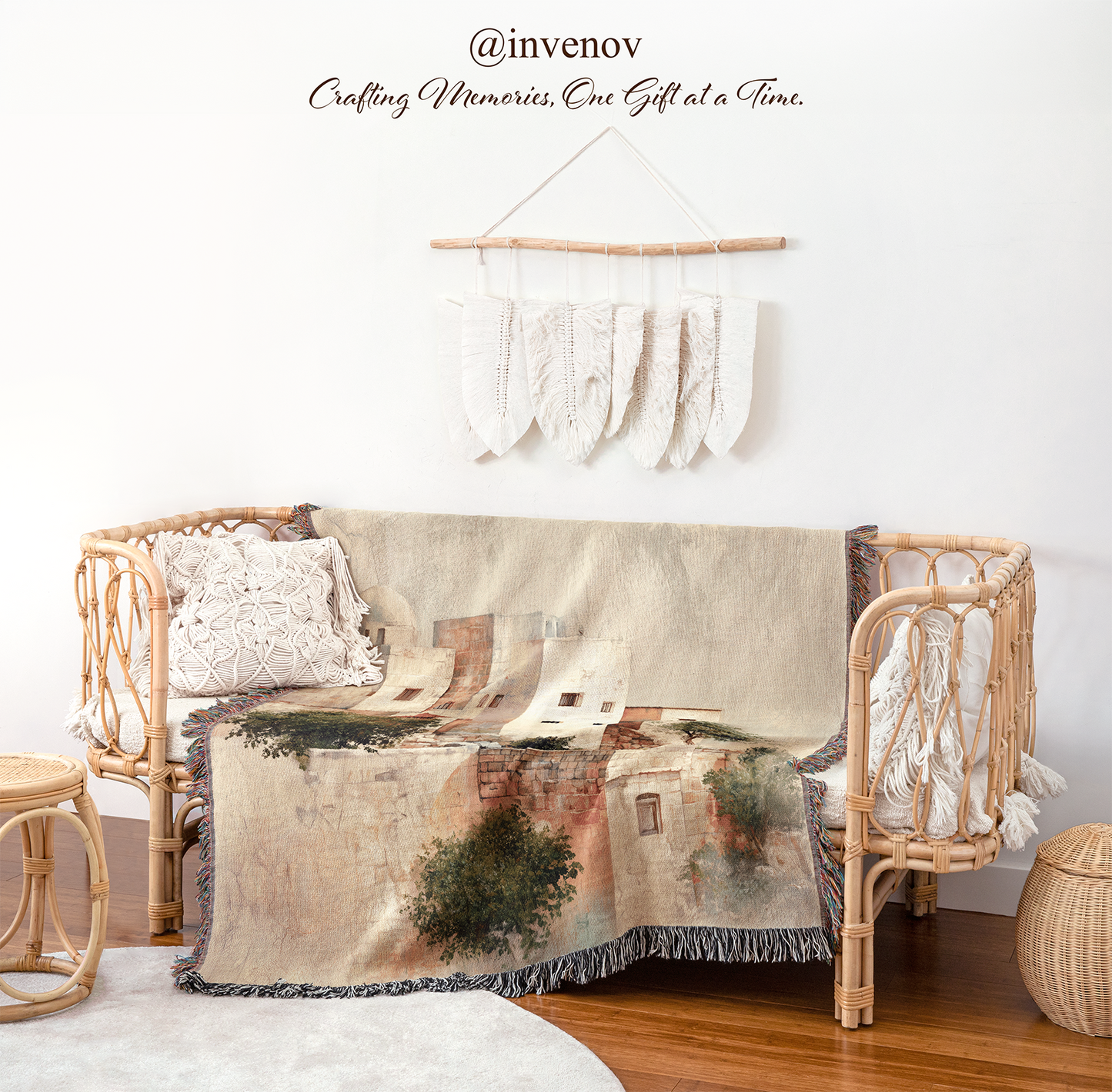 Decorative blanket with a scenic design draped over a wicker chair