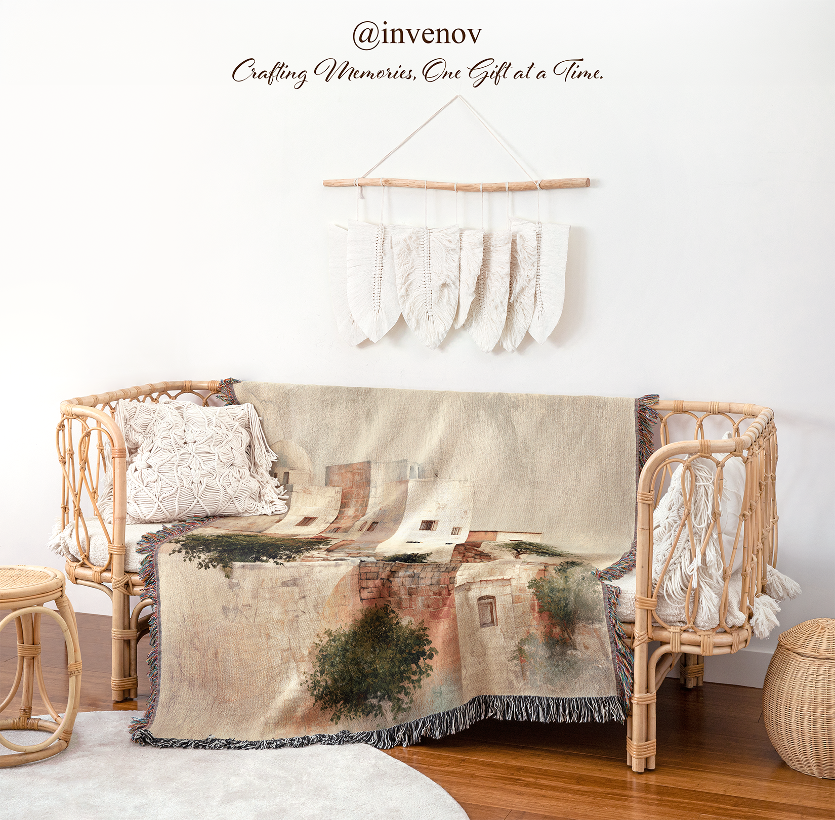 Decorative blanket with a scenic design draped over a wicker chair