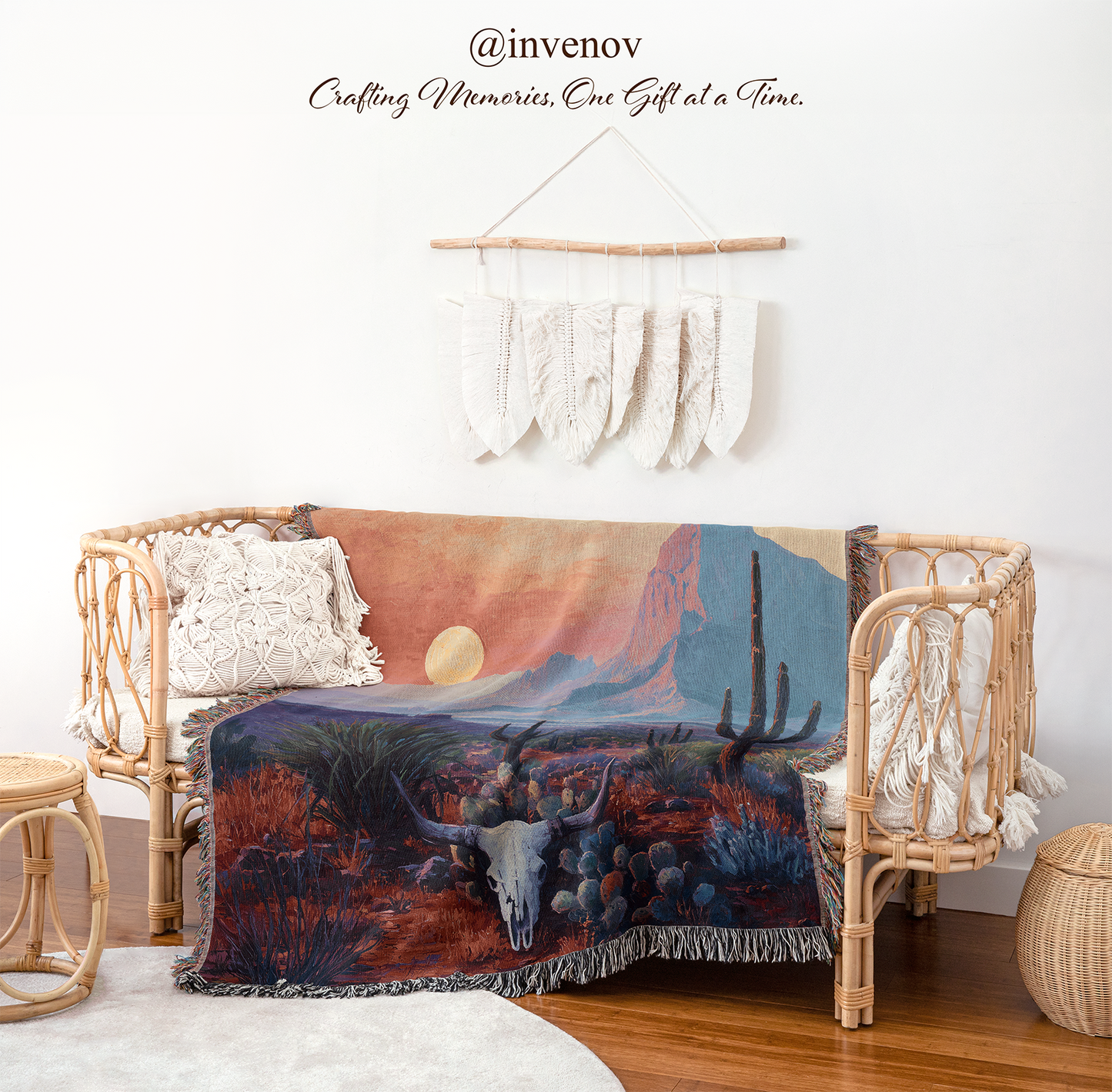 Decorative blanket with nature design draped over a wicker chair in a room setting.