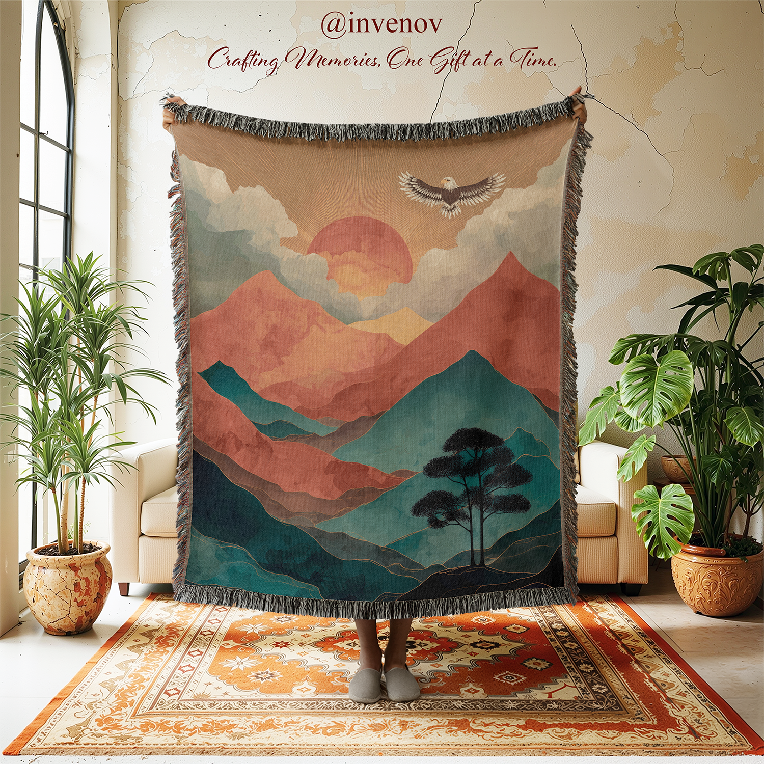 Decorative tapestry with mountain and sunset design in a room with plants and furniture.